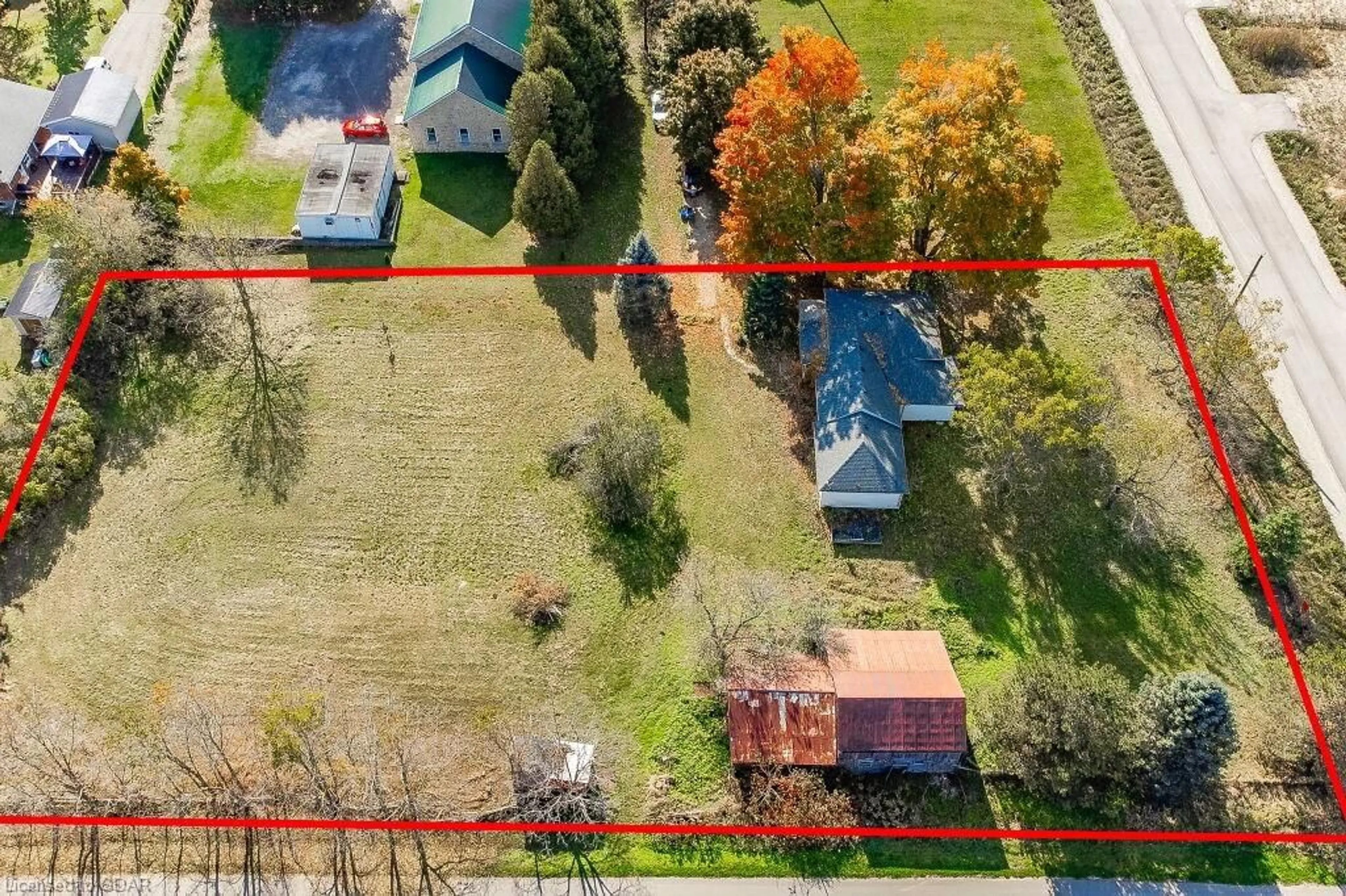 Frontside or backside of a home, the fenced backyard for 387 Evert St, Everton Ontario N0B 2K0