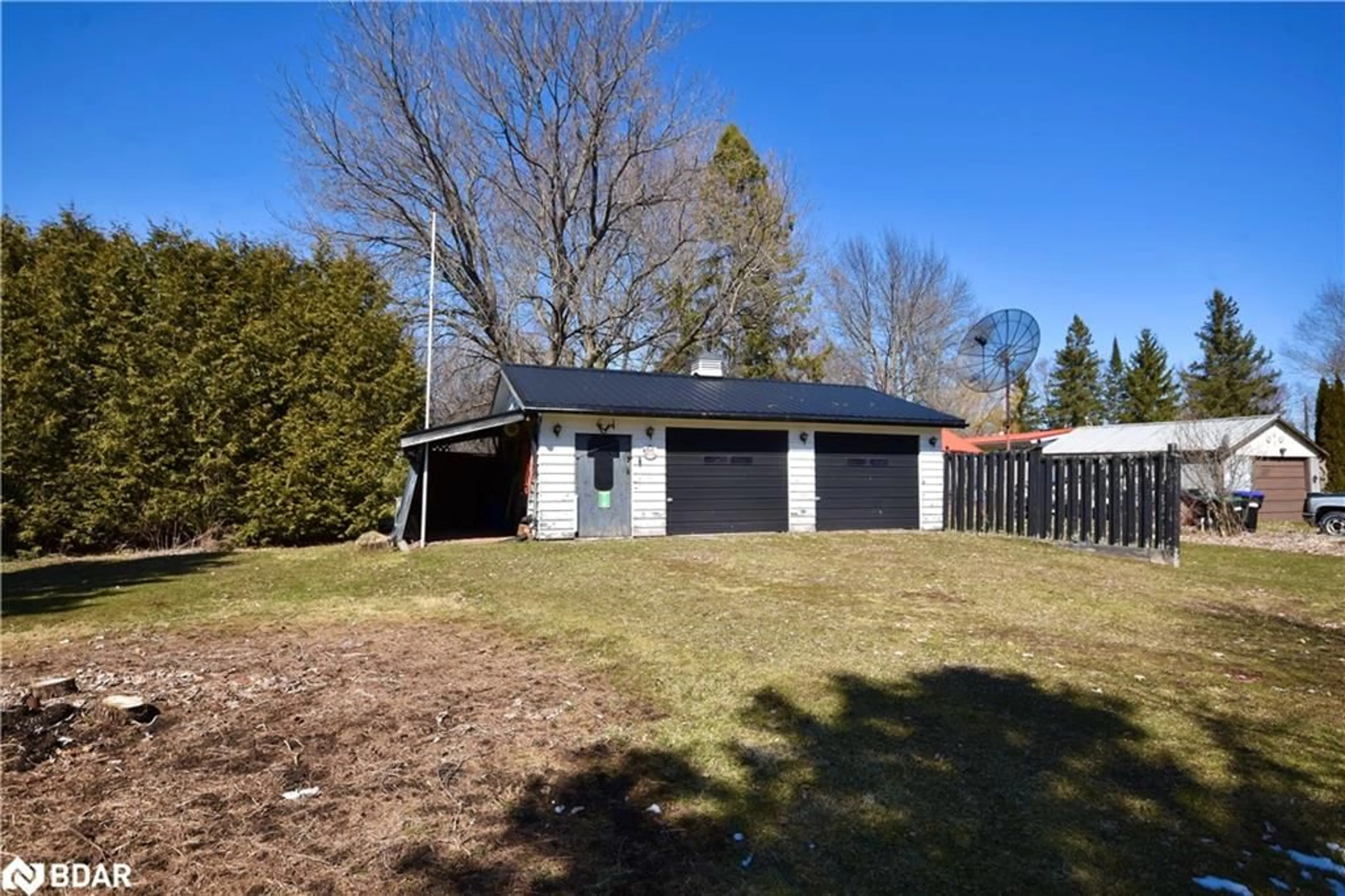 Frontside or backside of a home, the fenced backyard for 4146 Fountain Dr, Ramara Ontario L3V 0N5