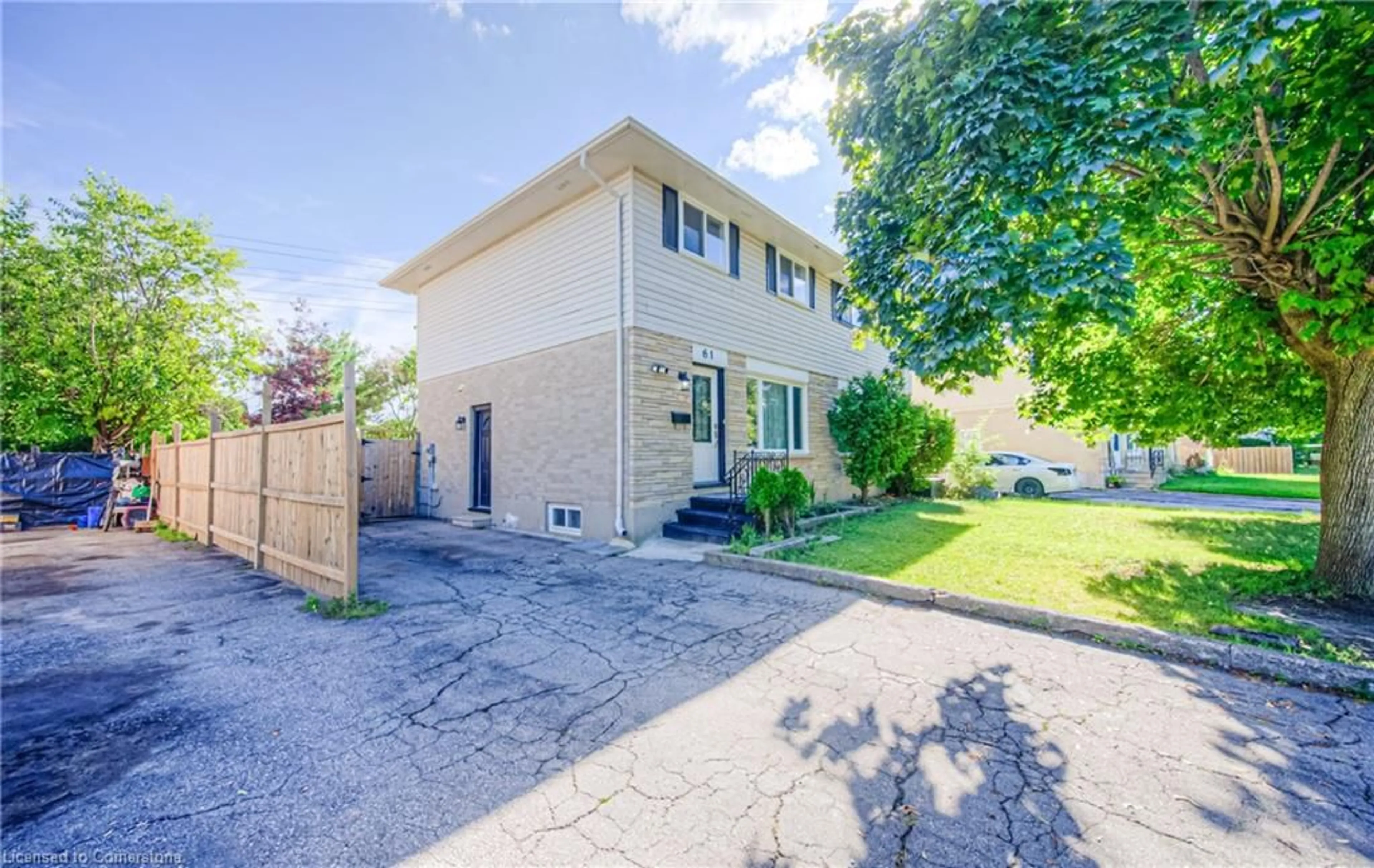 A pic from exterior of the house or condo, the fenced backyard for 61 Winter Ave, Cambridge Ontario N1R 5Z7