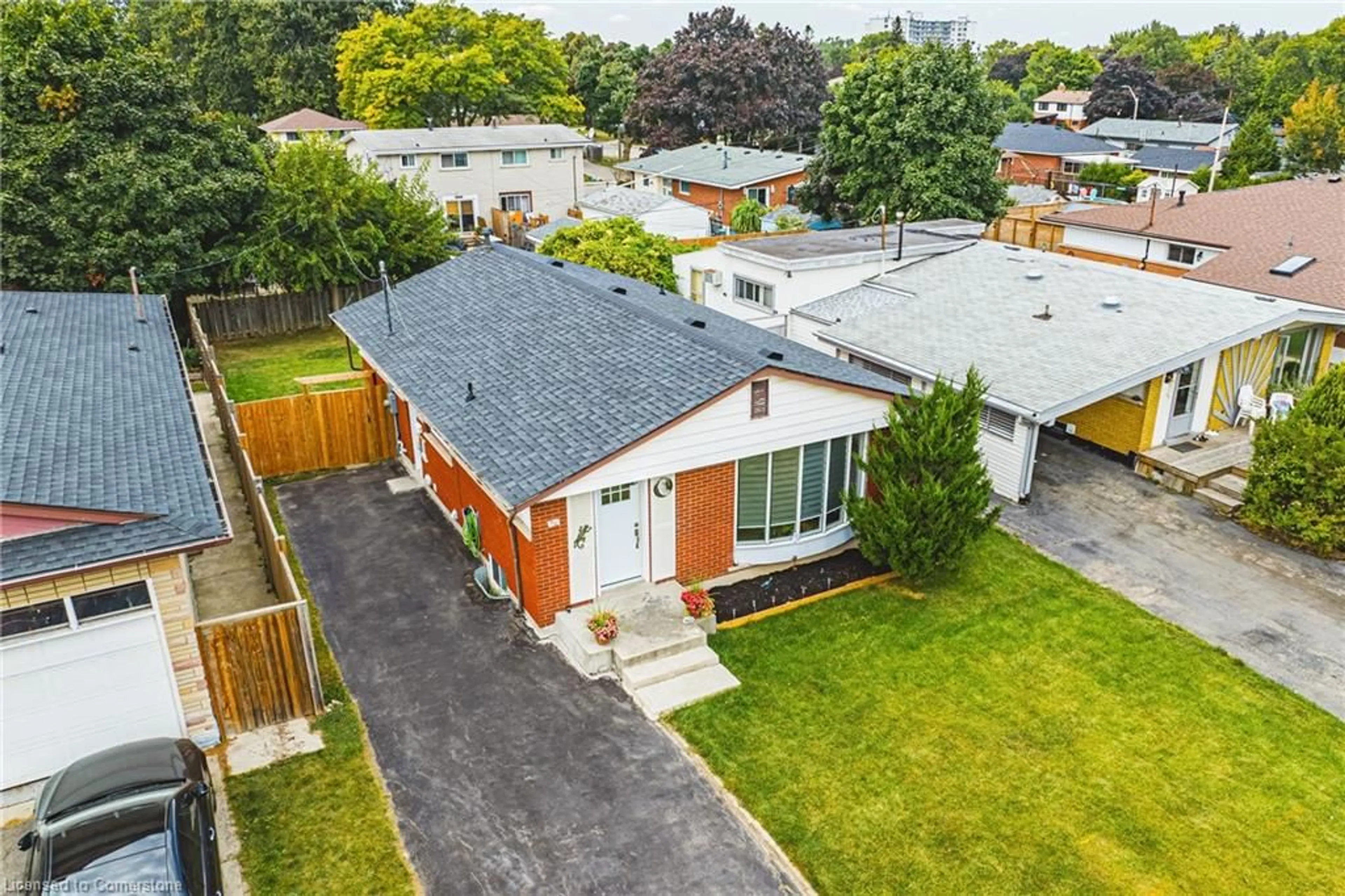 Frontside or backside of a home, the fenced backyard for 96 Cardinal Dr, Hamilton Ontario L9A 4H7