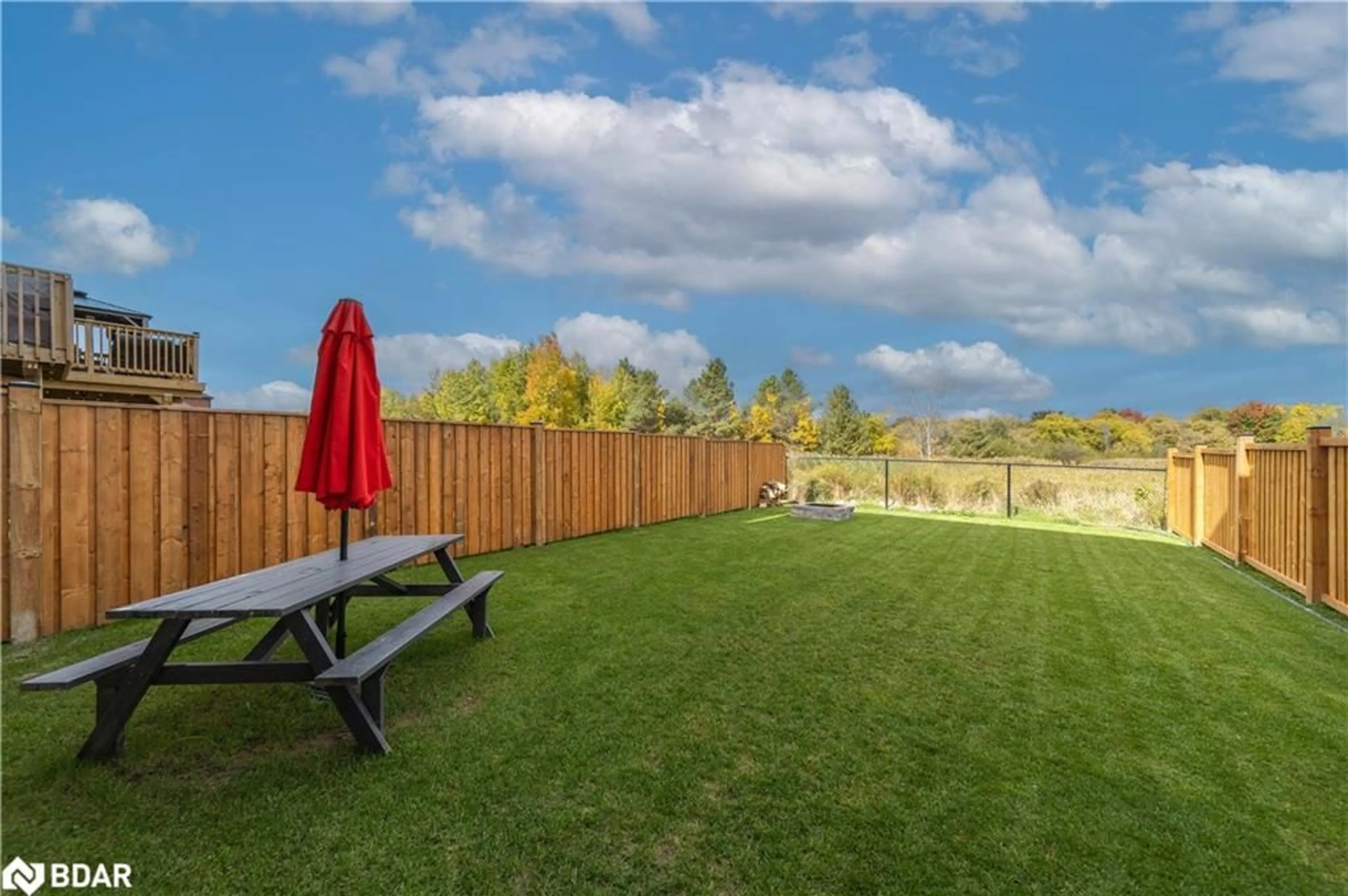 Patio, the fenced backyard for 42 Wood Cres, Essa Ontario L0M 1B5