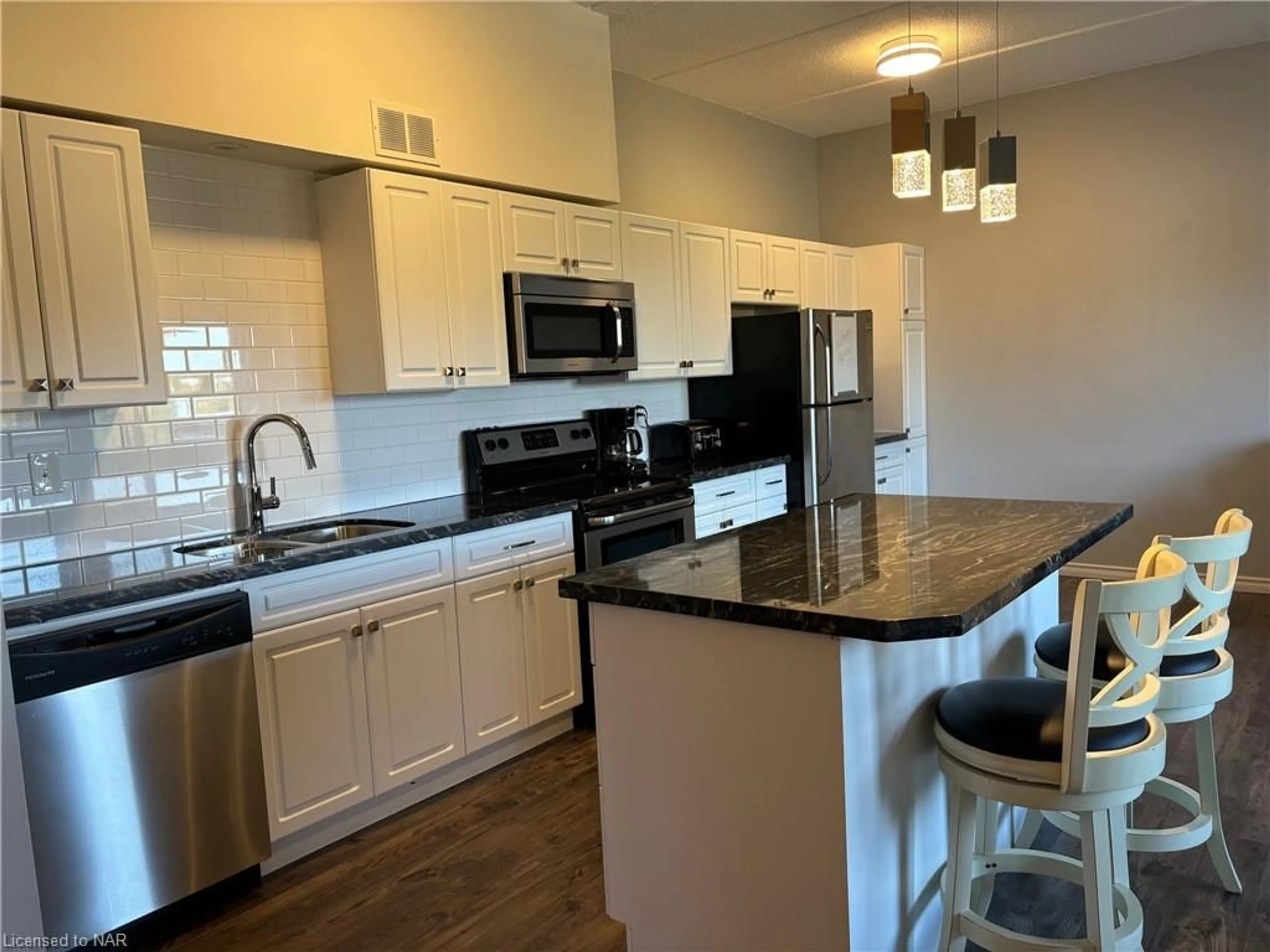 Open concept kitchen for 198 Scott St #513, St. Catharines Ontario L2N 5T3