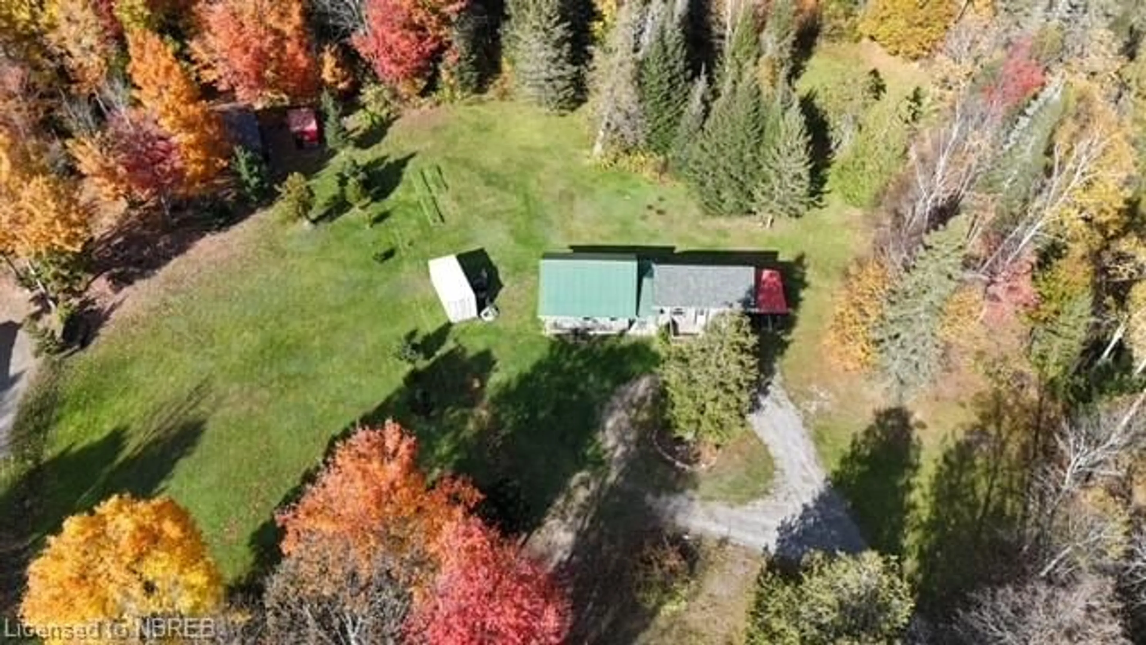 A pic from exterior of the house or condo, the fenced backyard for 615 Development Rd, Bonfield Ontario P0H 2E0