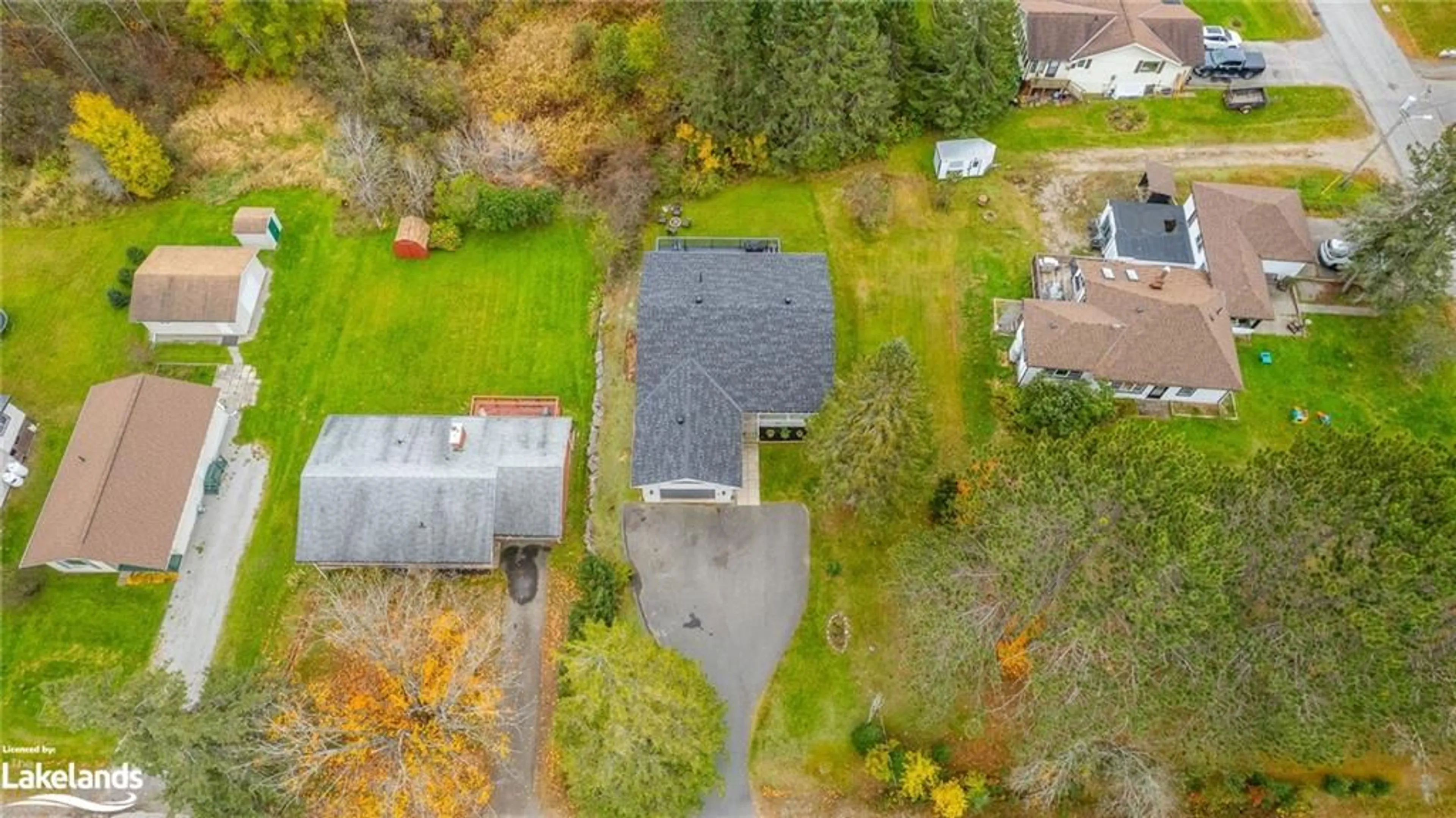 Frontside or backside of a home, the fenced backyard for 8 Mckay St, Minden Ontario K0M 2K0