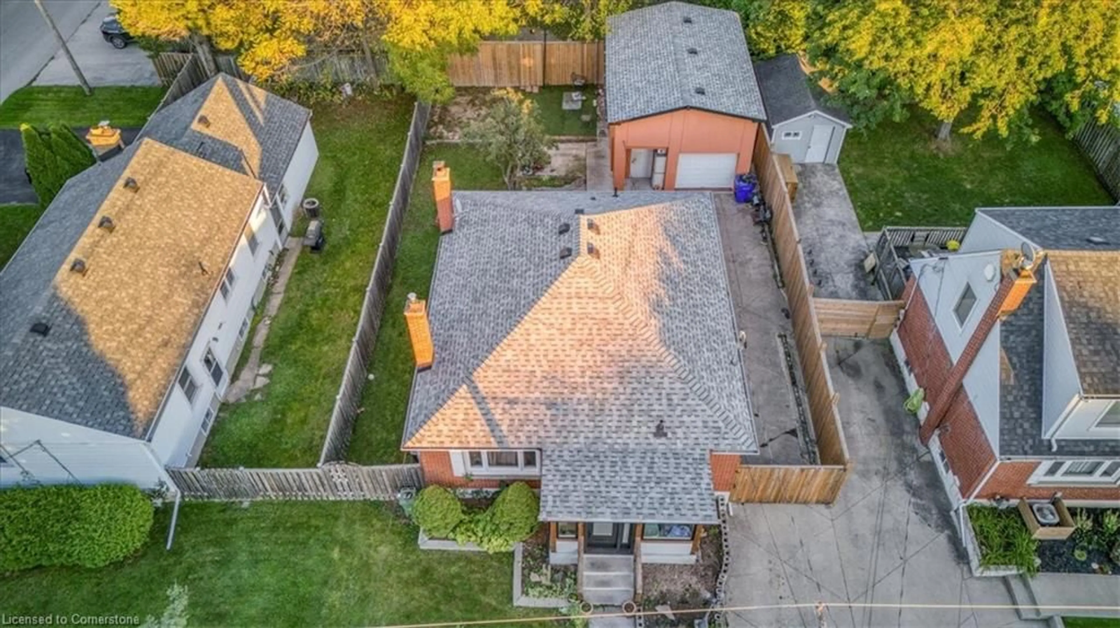 Frontside or backside of a home, the fenced backyard for 118 Second St, Stoney Creek Ontario L8G 1Z4