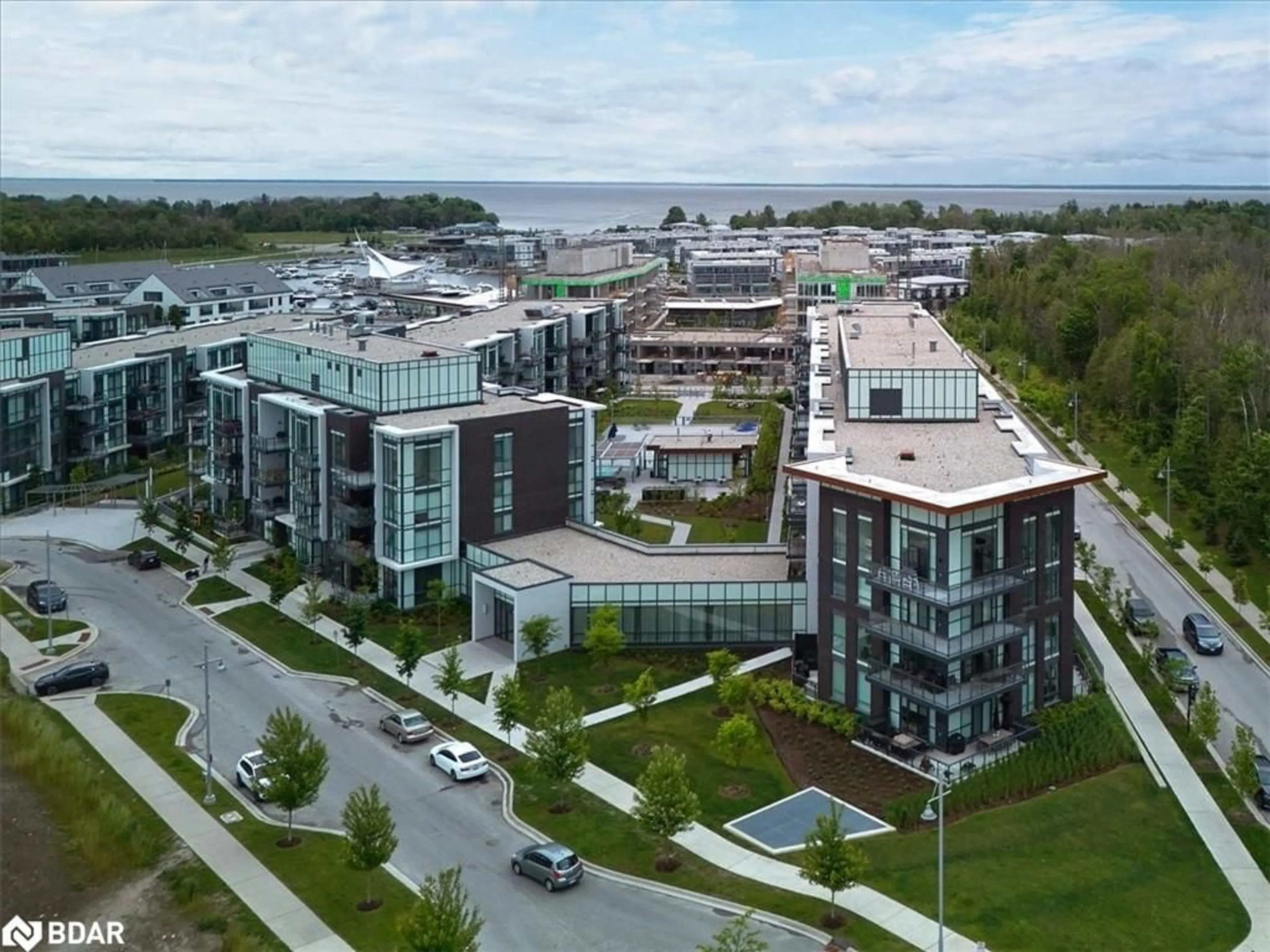 A pic from exterior of the house or condo, the view of city buildings for 415 Sea Ray Ave #249, Innisfil Ontario L9S 0M3