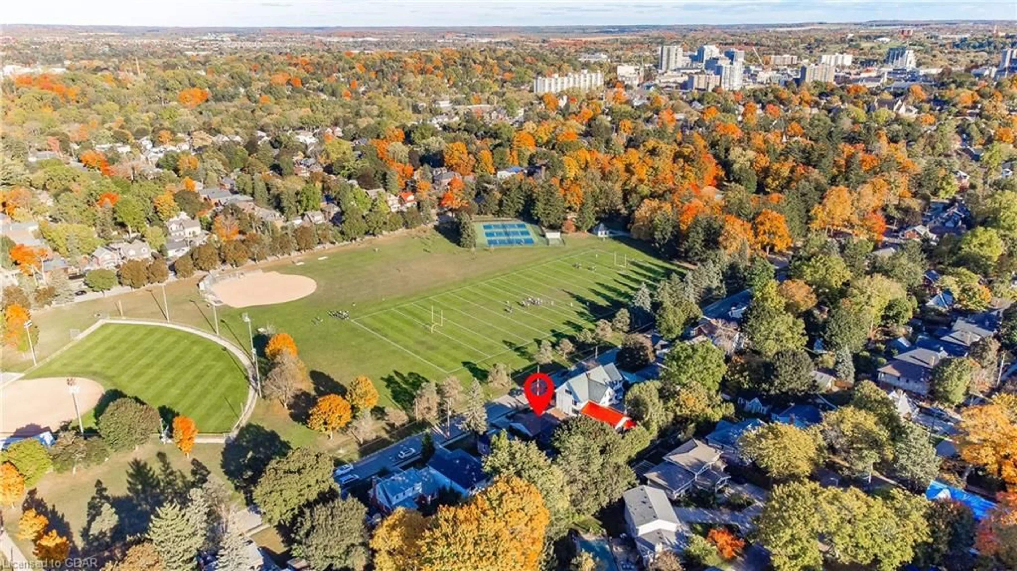 A pic from exterior of the house or condo, the fenced backyard for 106/108 Kathleen St, Guelph Ontario N1H 4Y3