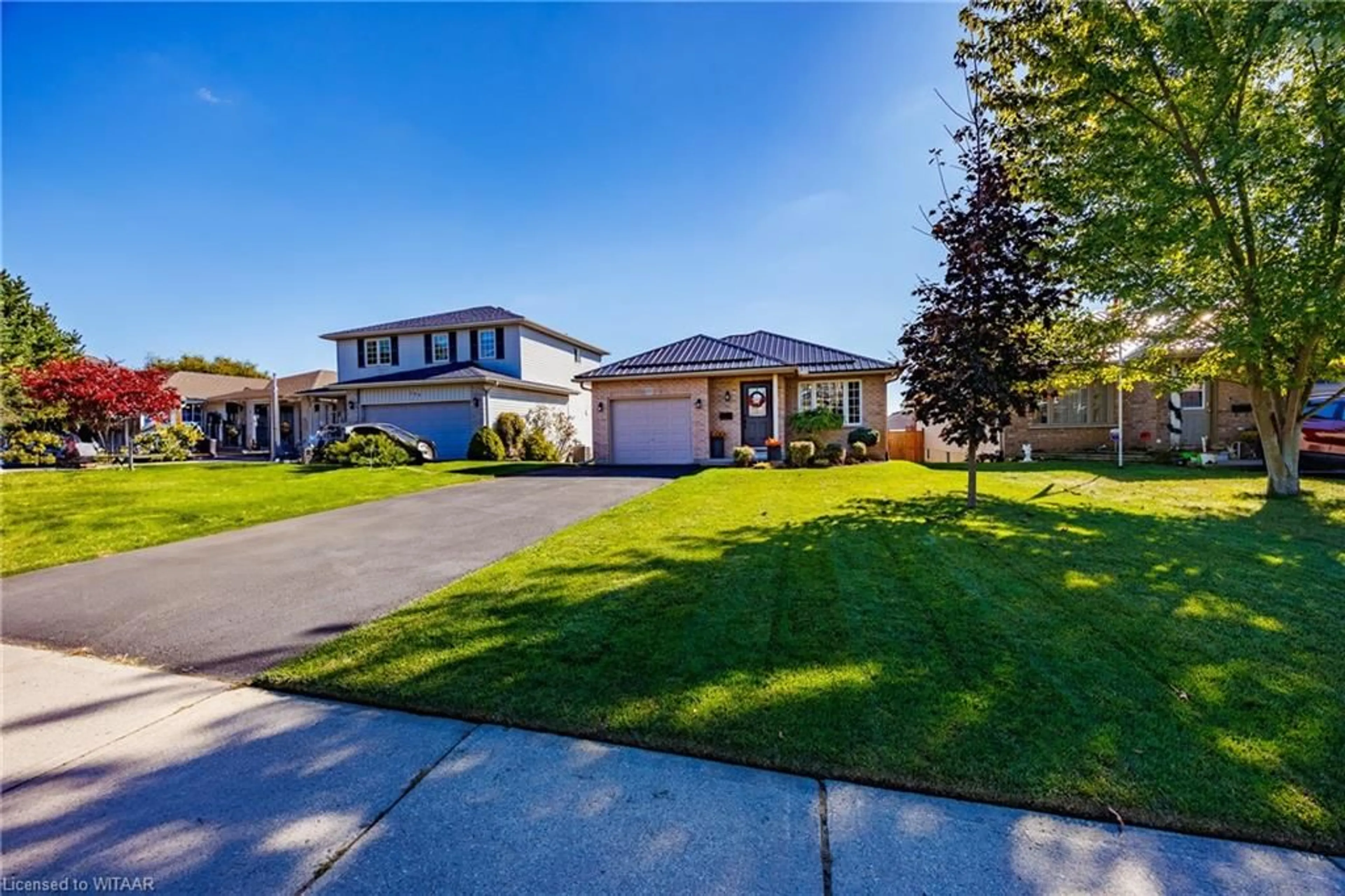 Frontside or backside of a home, the fenced backyard for 207 North St, Tillsonburg Ontario N4G 1B8