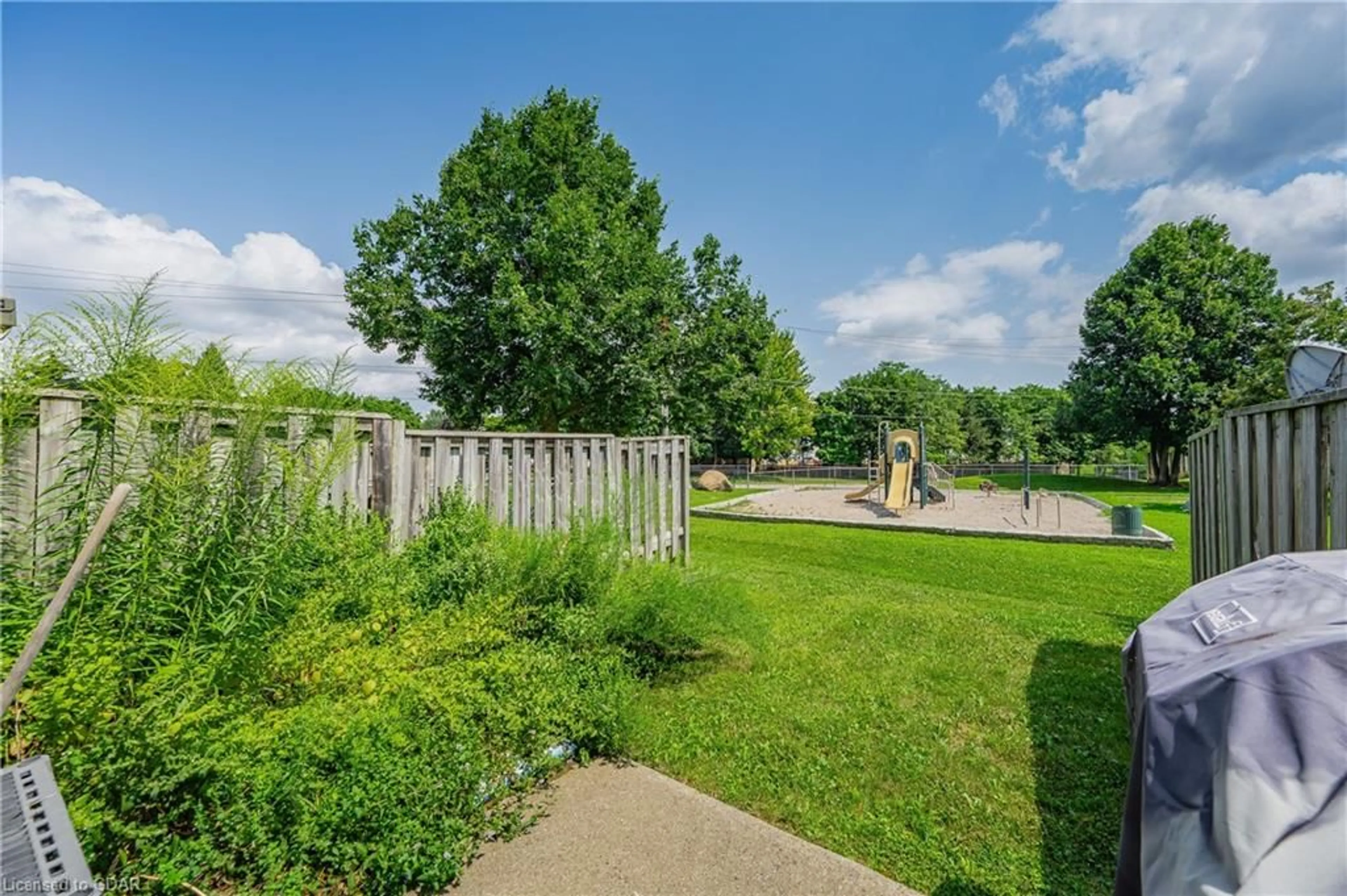 Patio, the fenced backyard for 40 Imperial Rd #5, Guelph Ontario N1H 8B4