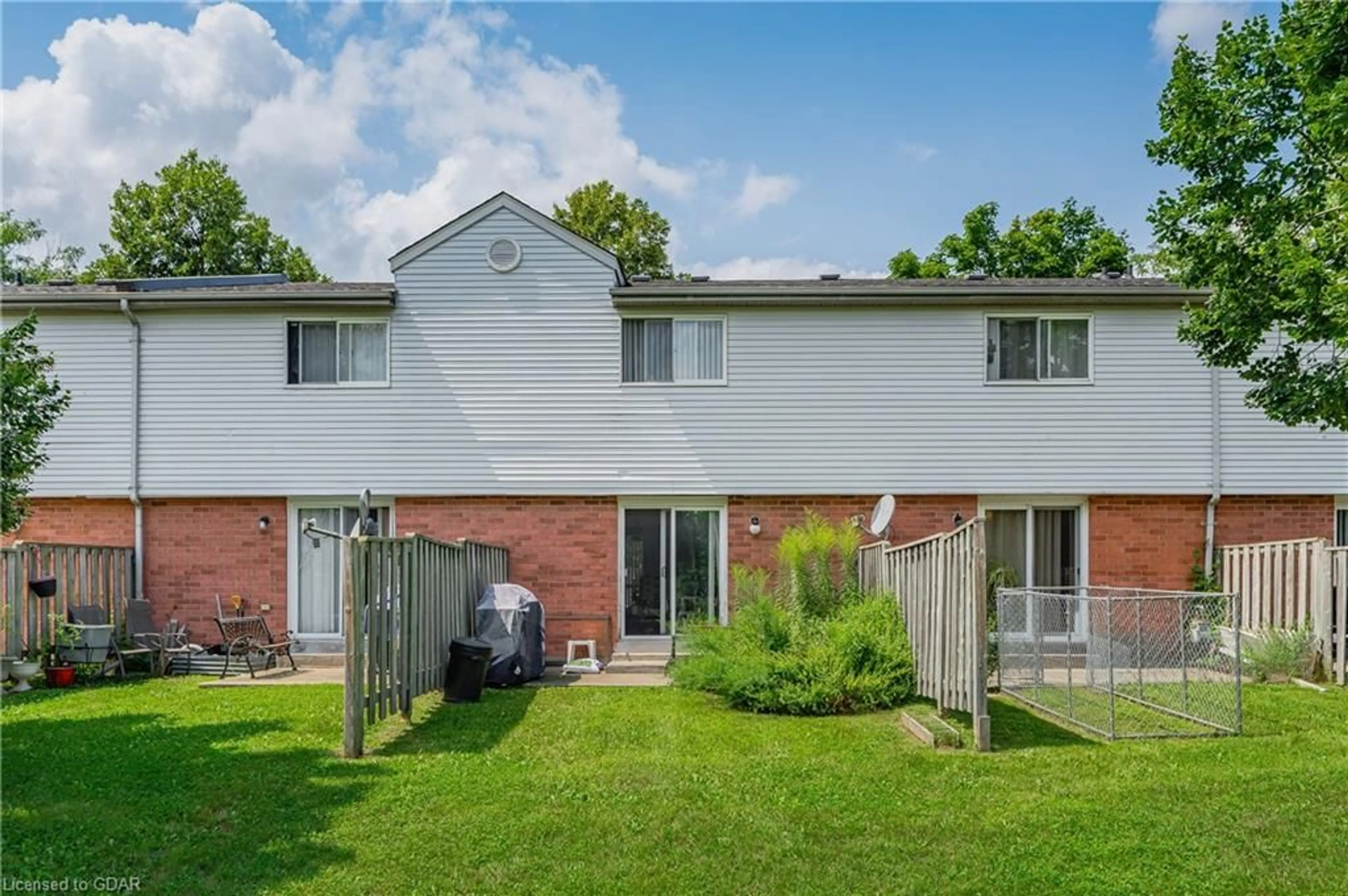 Frontside or backside of a home, the fenced backyard for 40 Imperial Rd #5, Guelph Ontario N1H 8B4