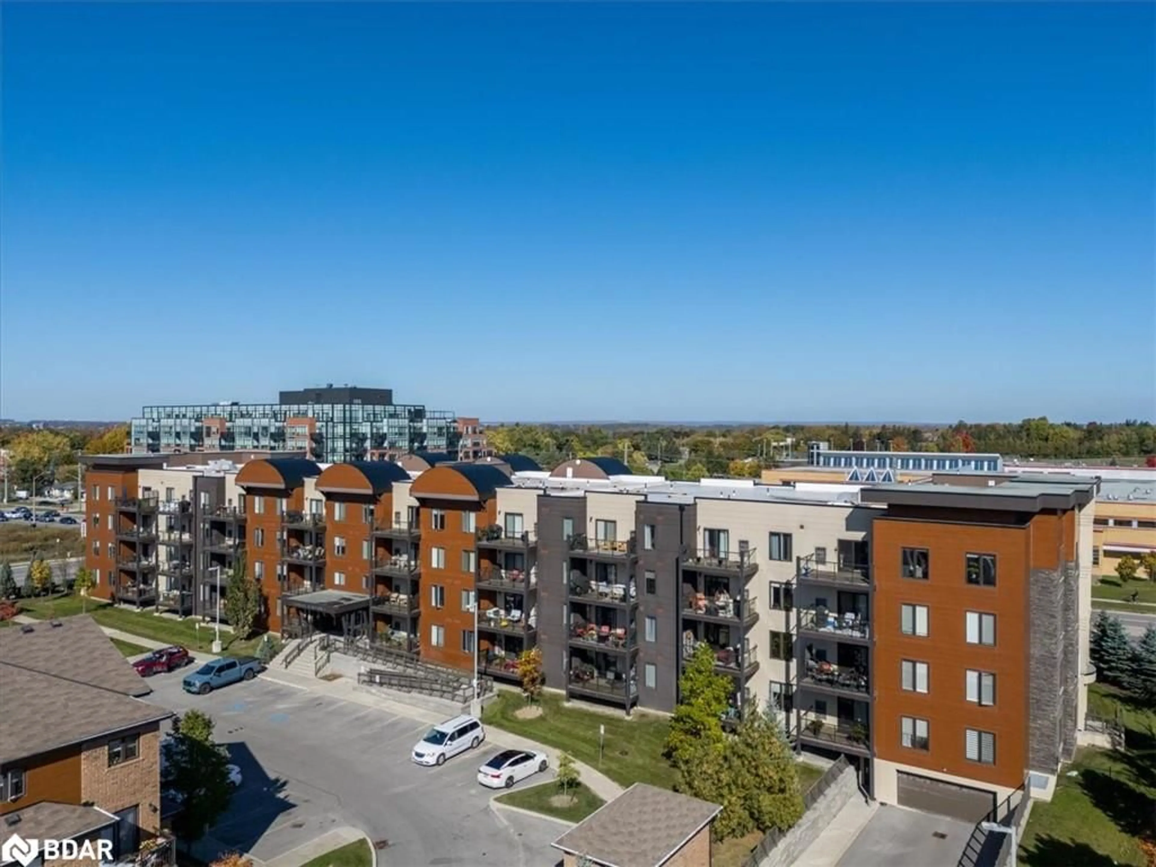 A pic from exterior of the house or condo, the view of city buildings for 720 Yonge St #202, Barrie Ontario L9J 0G9