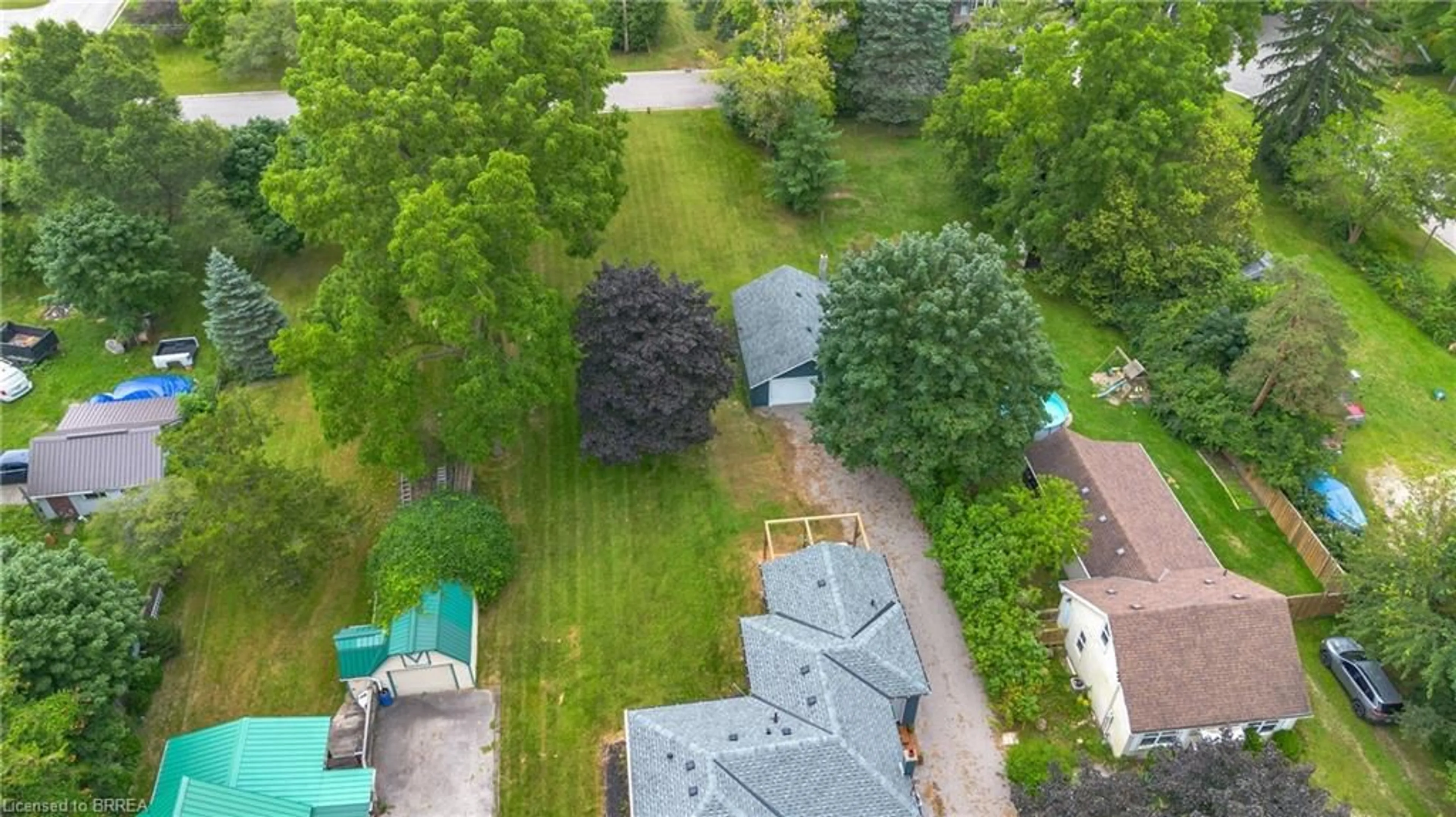 A pic from exterior of the house or condo, the fenced backyard for 742 Mount Pleasant Rd, Mount Pleasant Ontario N3T 5L5