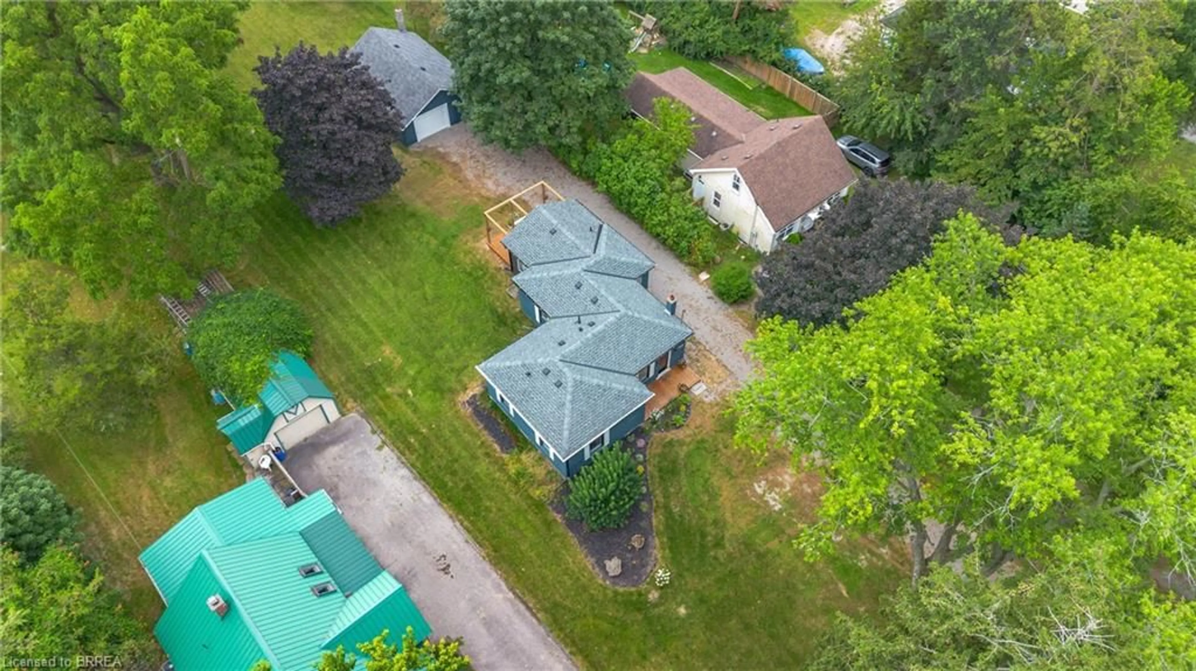 Frontside or backside of a home, the fenced backyard for 742 Mount Pleasant Rd, Mount Pleasant Ontario N3T 5L5