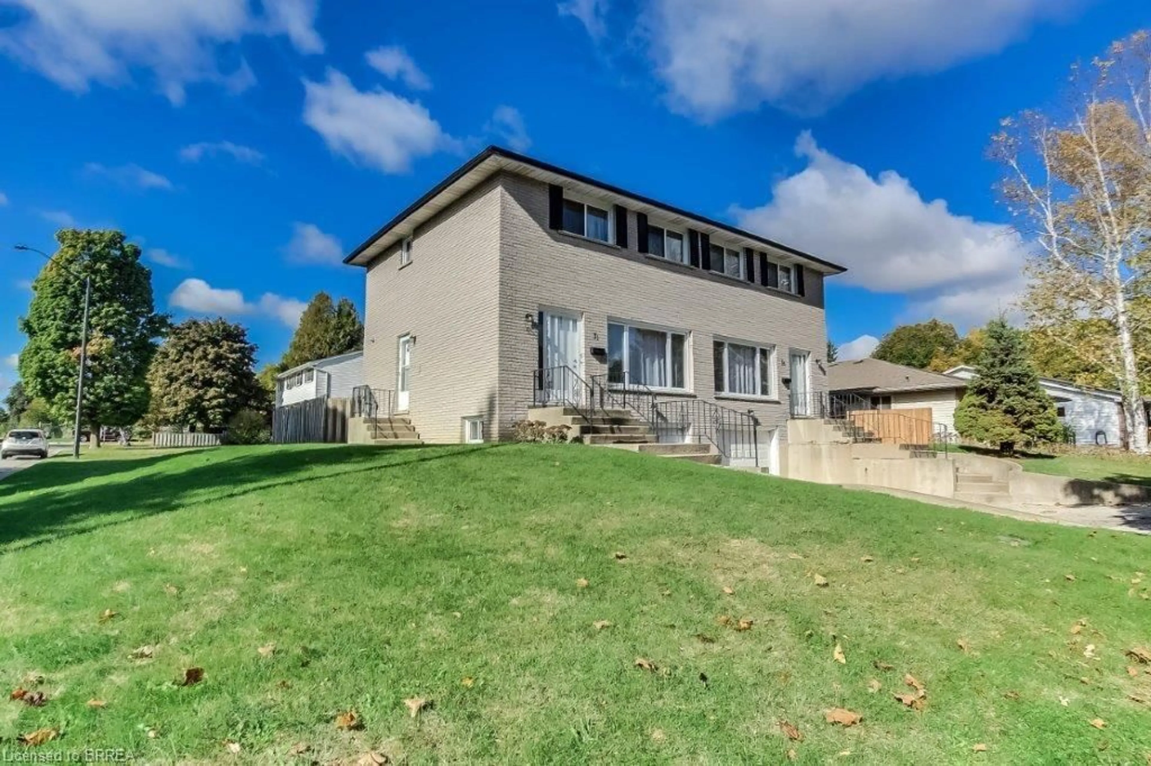 A pic from exterior of the house or condo, the fenced backyard for 31-33 Ivanhoe Rd, Brantford Ontario N3R 6V1