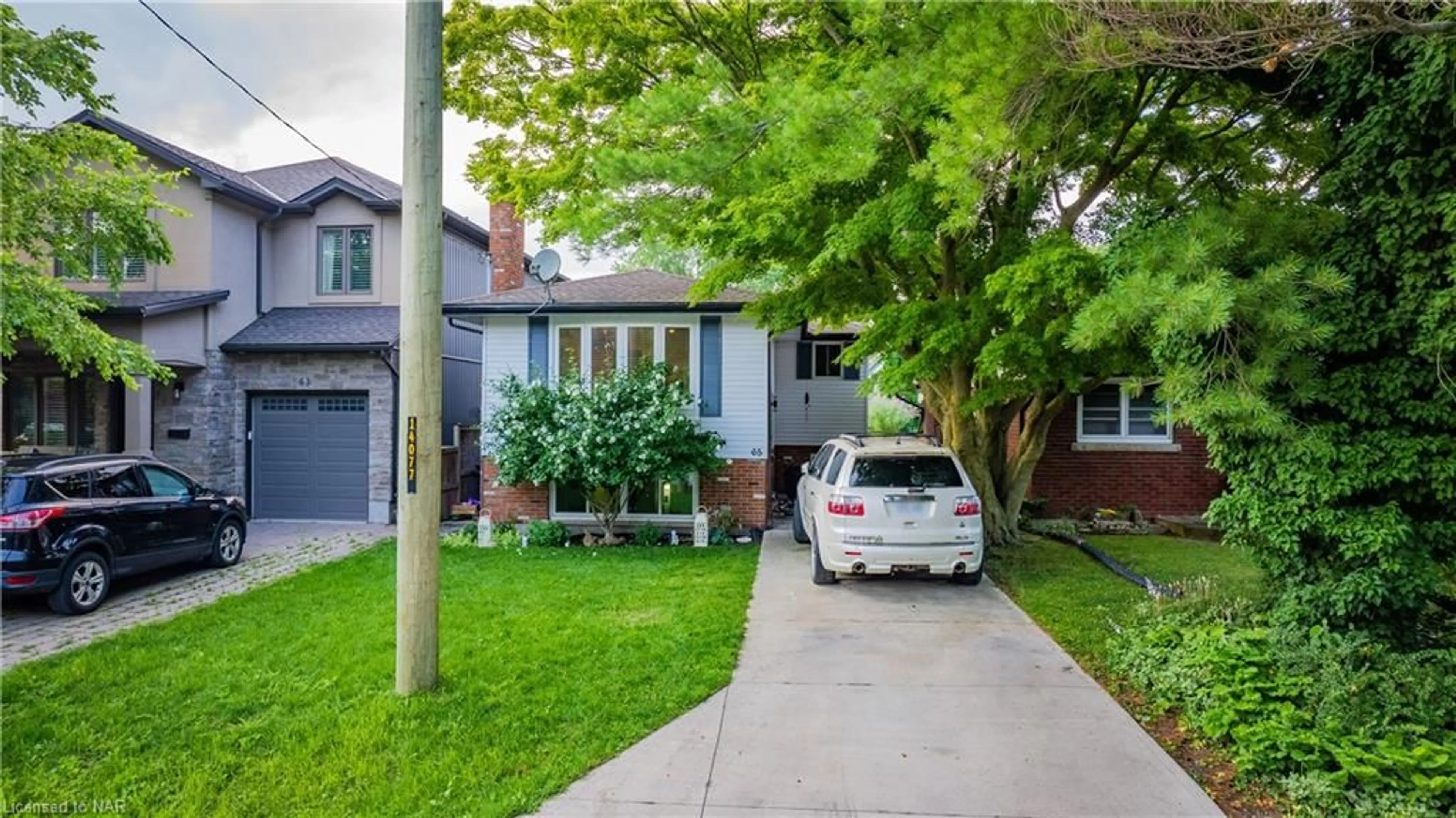 Frontside or backside of a home, the street view for 65 Wildwood Rd, St. Catharines Ontario L2M 1E1