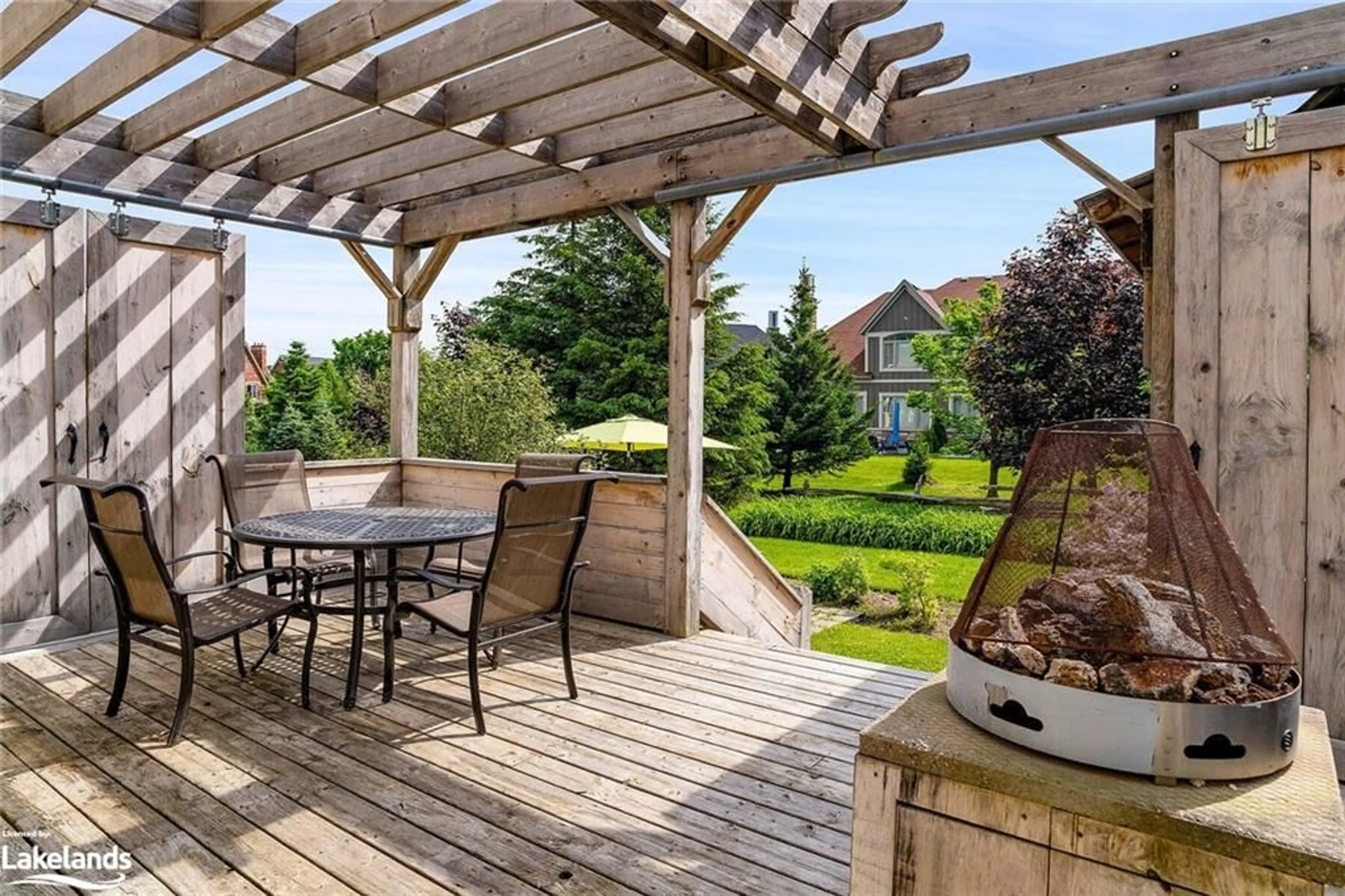 Patio, the fenced backyard for 129 Snowbridge Way, The Blue Mountains Ontario L9Y 0V1