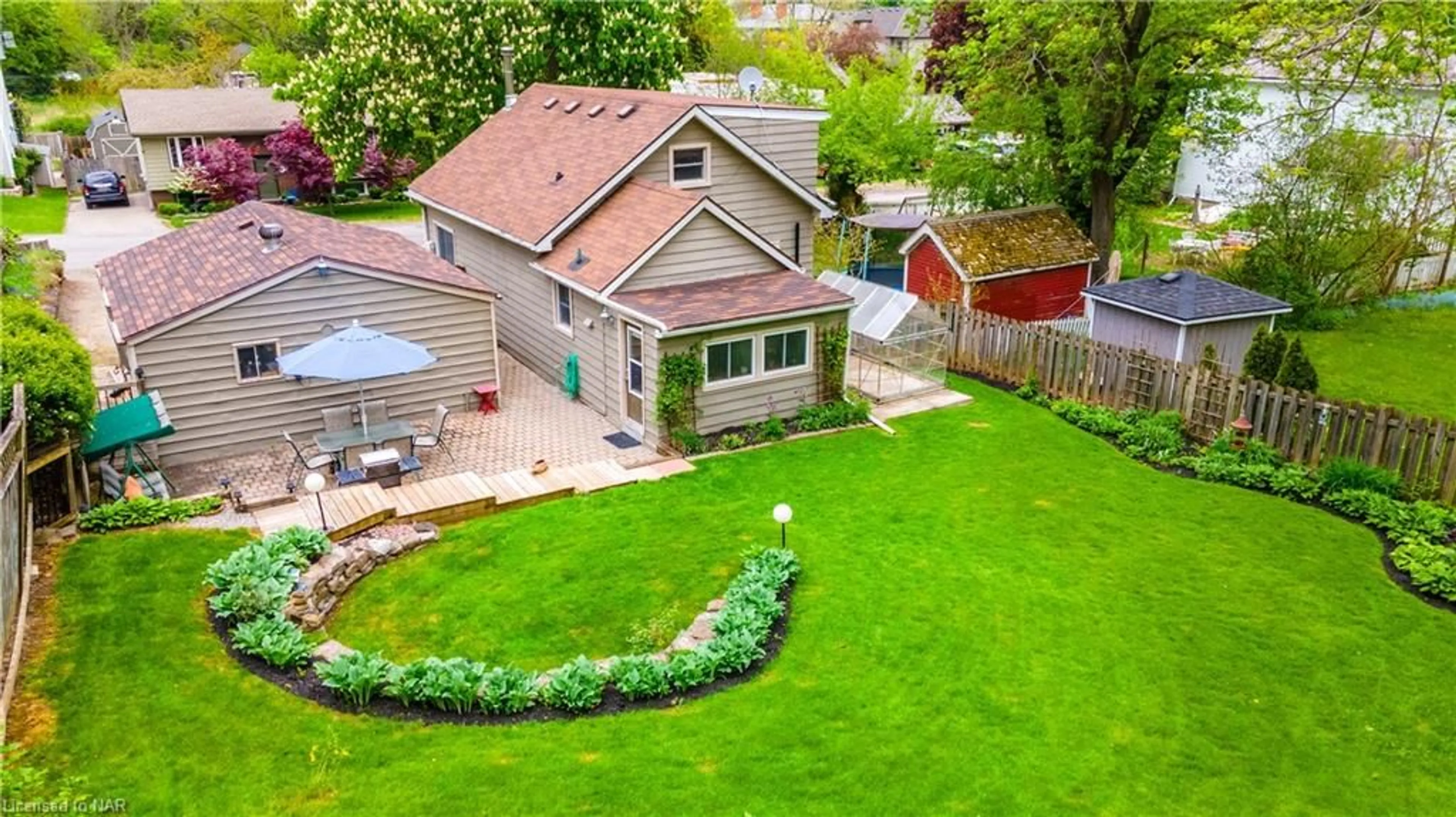 Frontside or backside of a home, the fenced backyard for 25 Highlander St, Niagara-on-the-Lake Ontario L0S 1L0