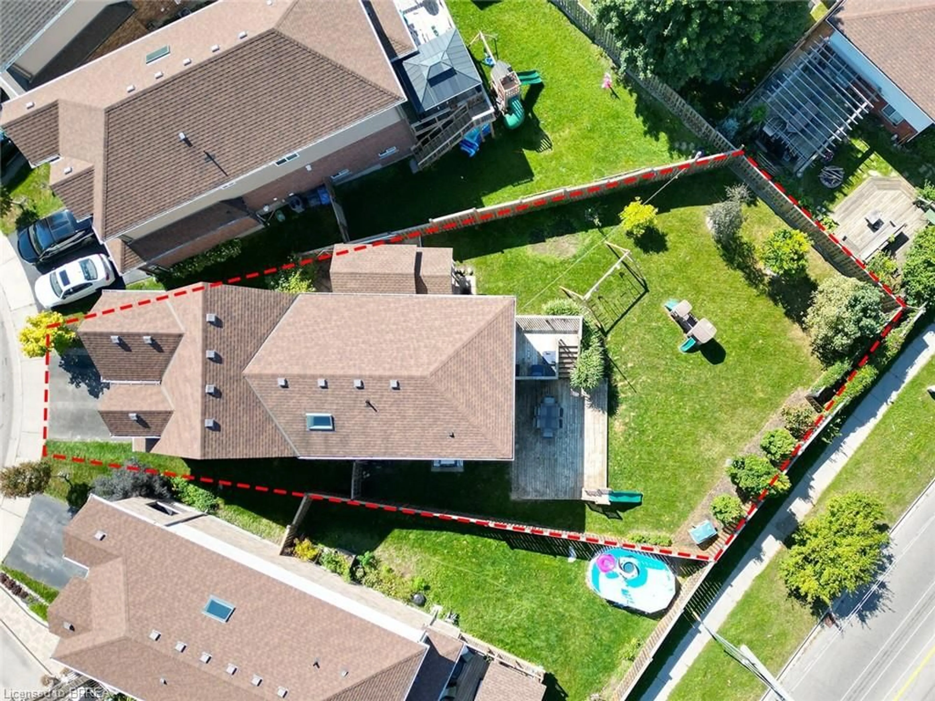 Frontside or backside of a home, the fenced backyard for 8 Oakes Crt, Guelph Ontario N1E 0J6