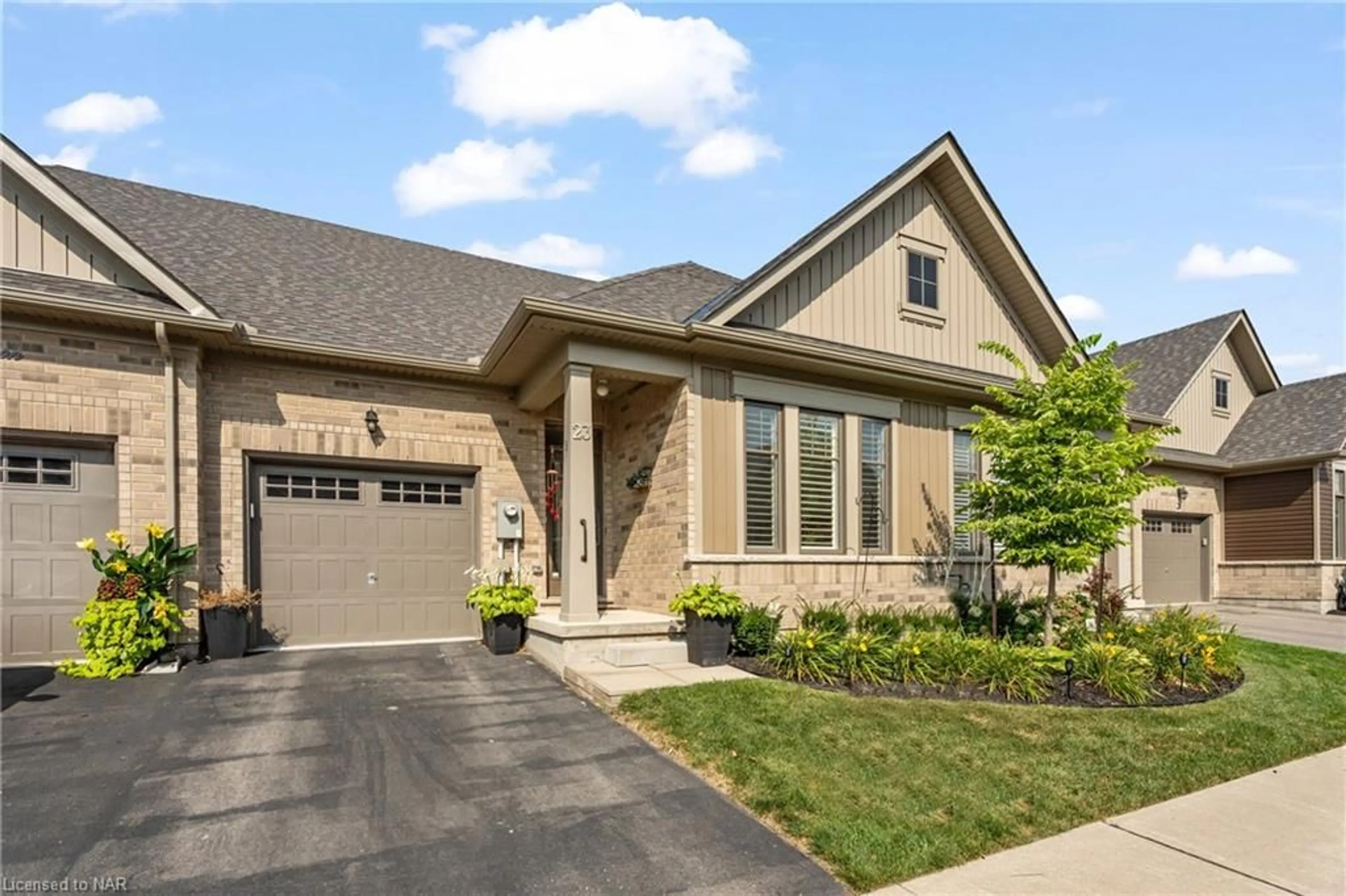 Home with brick exterior material for 23 Cosmopolitan Common, St. Catharines Ontario L2M 0B8