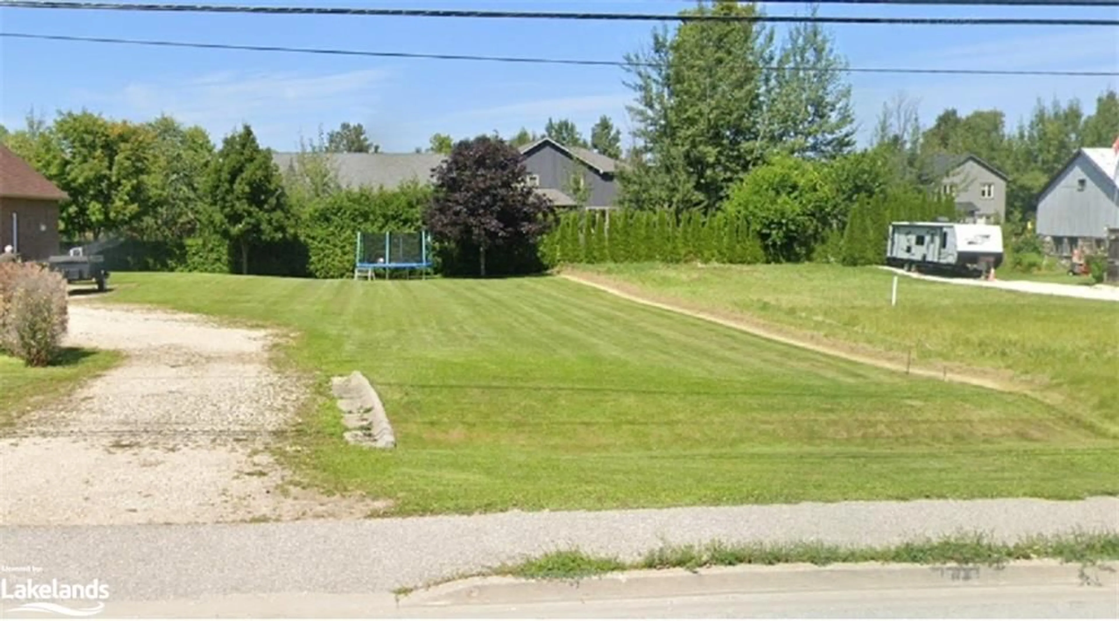 Frontside or backside of a home, the fenced backyard for 7708 Poplar Side Road, Collingwood Ontario L9Y 0G5