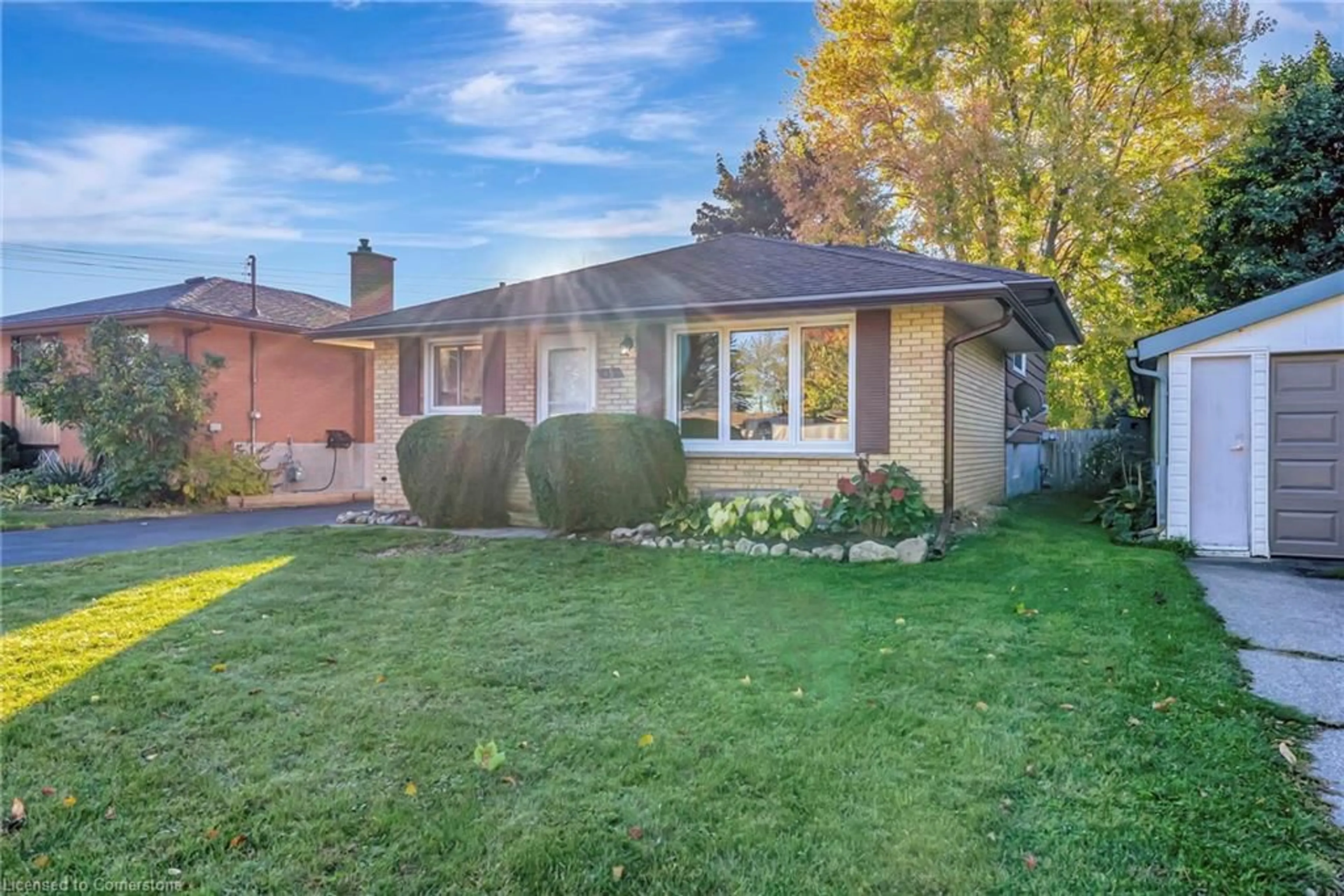 Frontside or backside of a home, the fenced backyard for 15 Belton Dr, Kitchener Ontario N2M 2B7