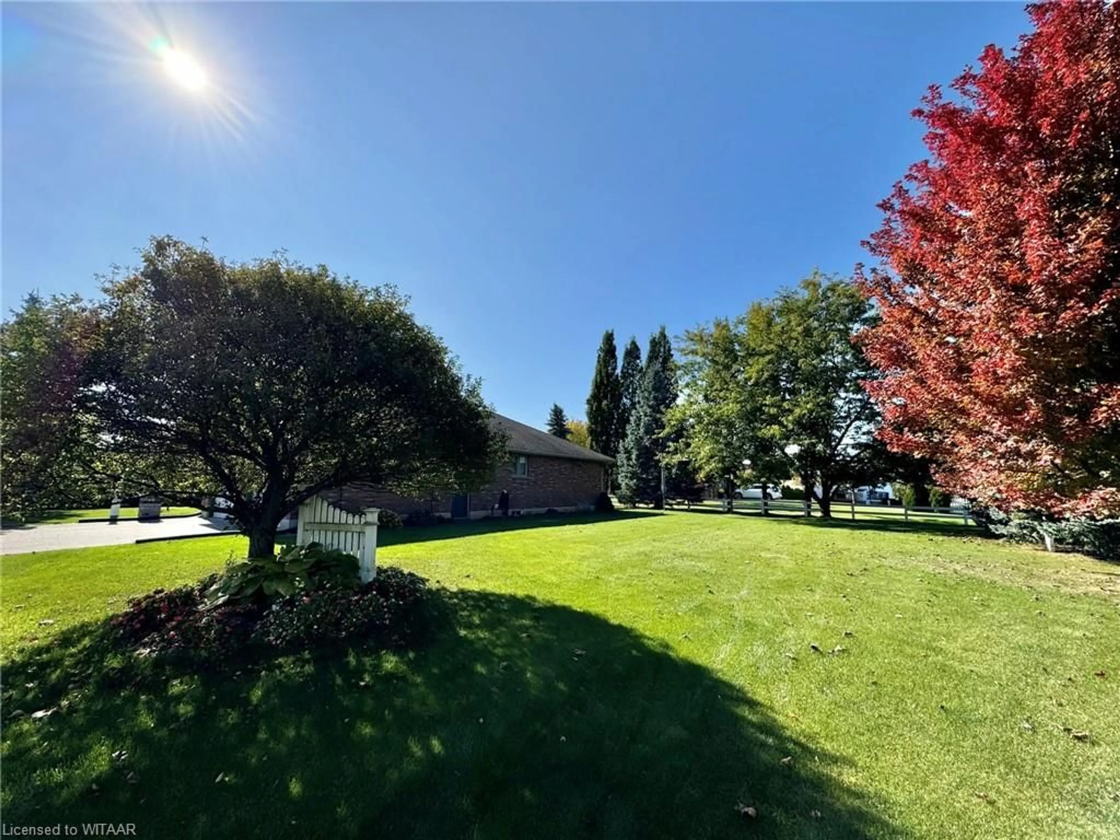 A pic from exterior of the house or condo, the fenced backyard for 48 Quinn Dr, Salford Ontario N0J 1W0