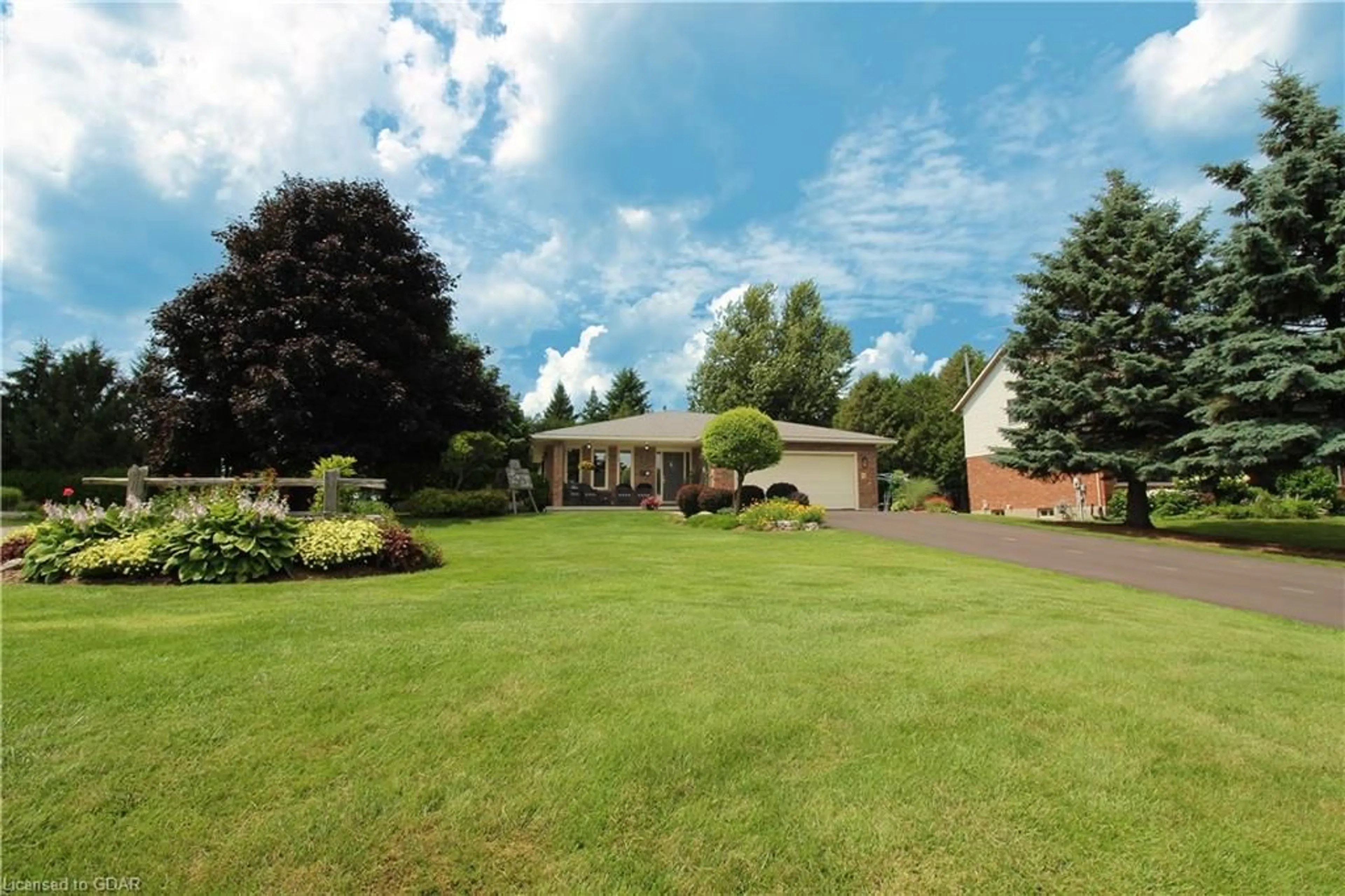 Frontside or backside of a home, the fenced backyard for 6 Atchison Lane, Fergus Ontario N1M 3K1