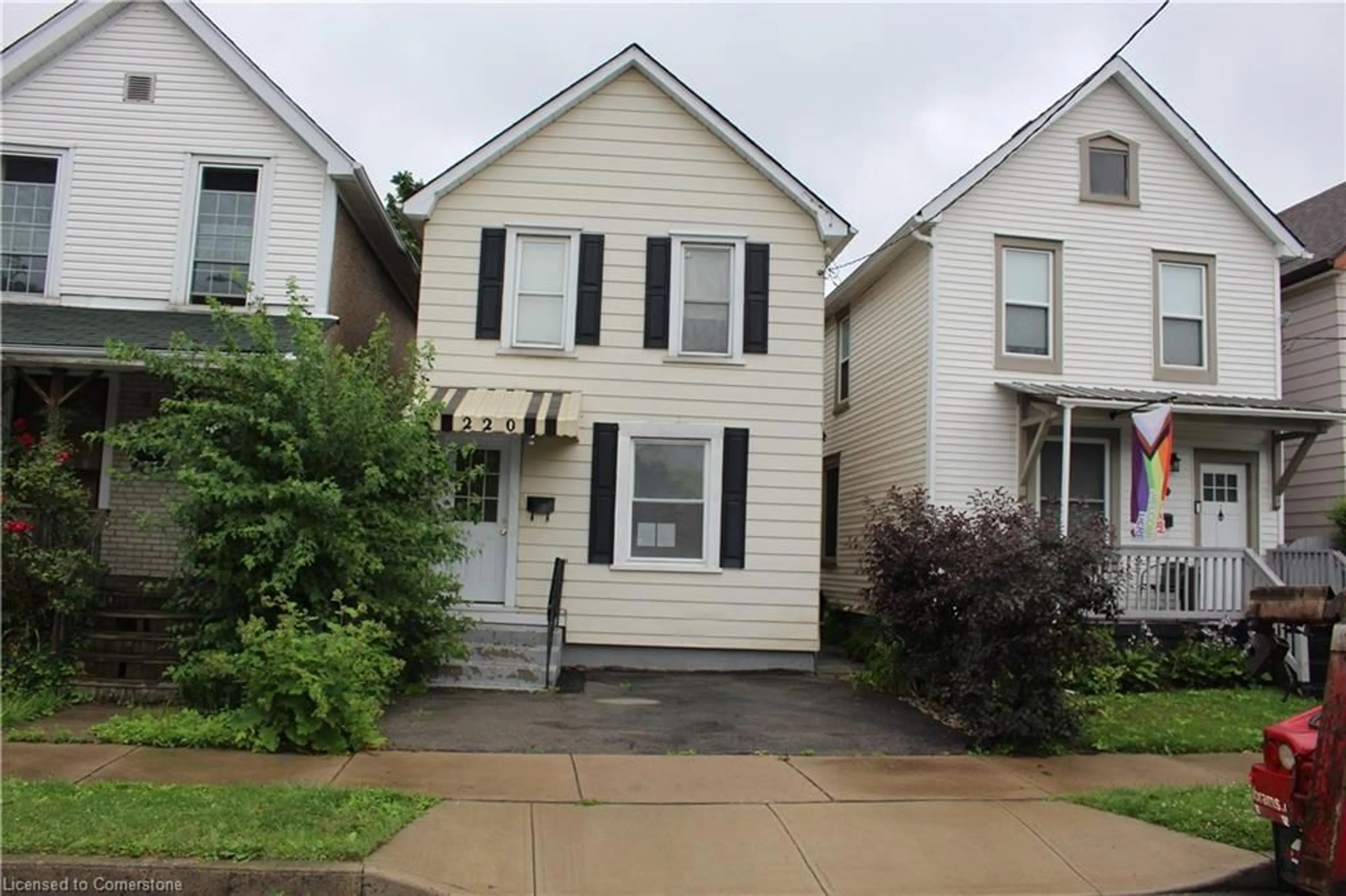 Frontside or backside of a home, the street view for 220 Belmont Ave, Hamilton Ontario L8L 7M6