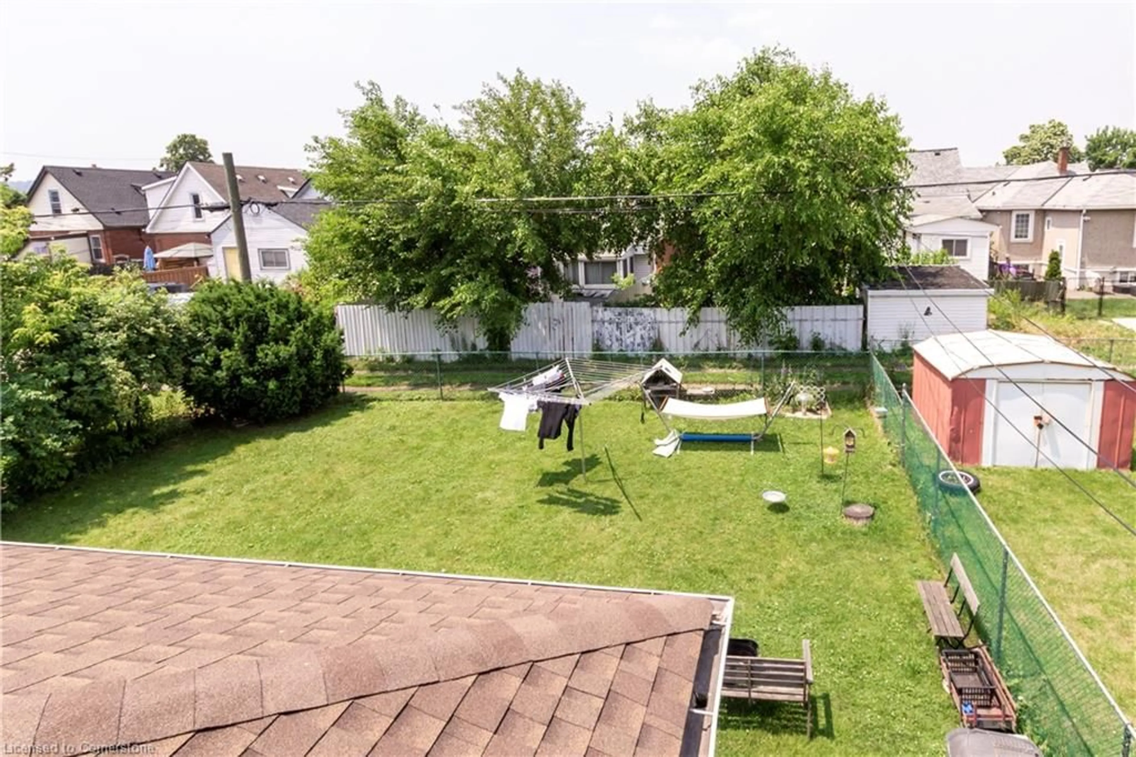 Patio, the fenced backyard for 311 Weir St, Hamilton Ontario L8H 5G4