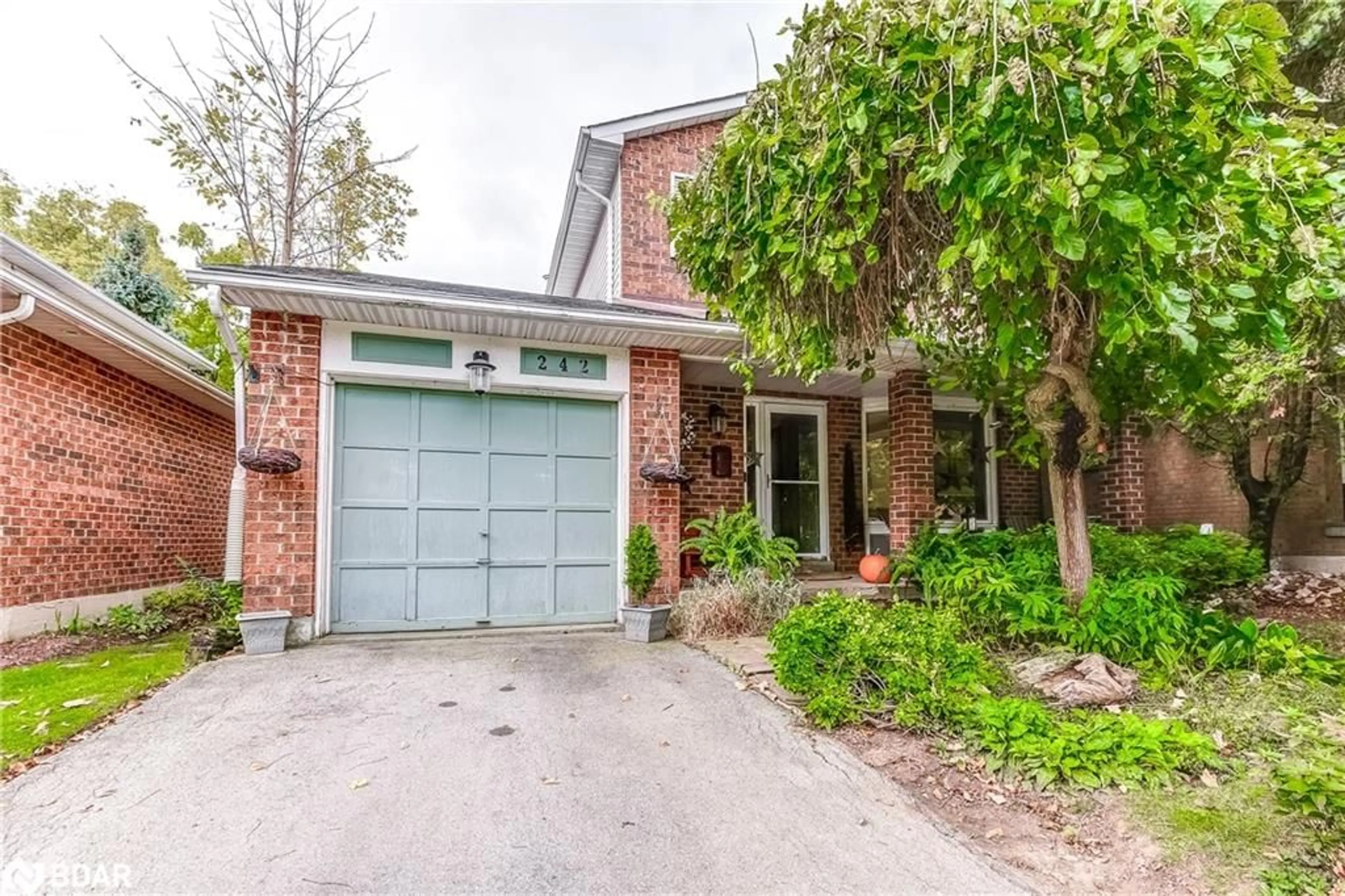 Home with brick exterior material for 242 Village Wood Rd, Oakville Ontario L6L 5X2