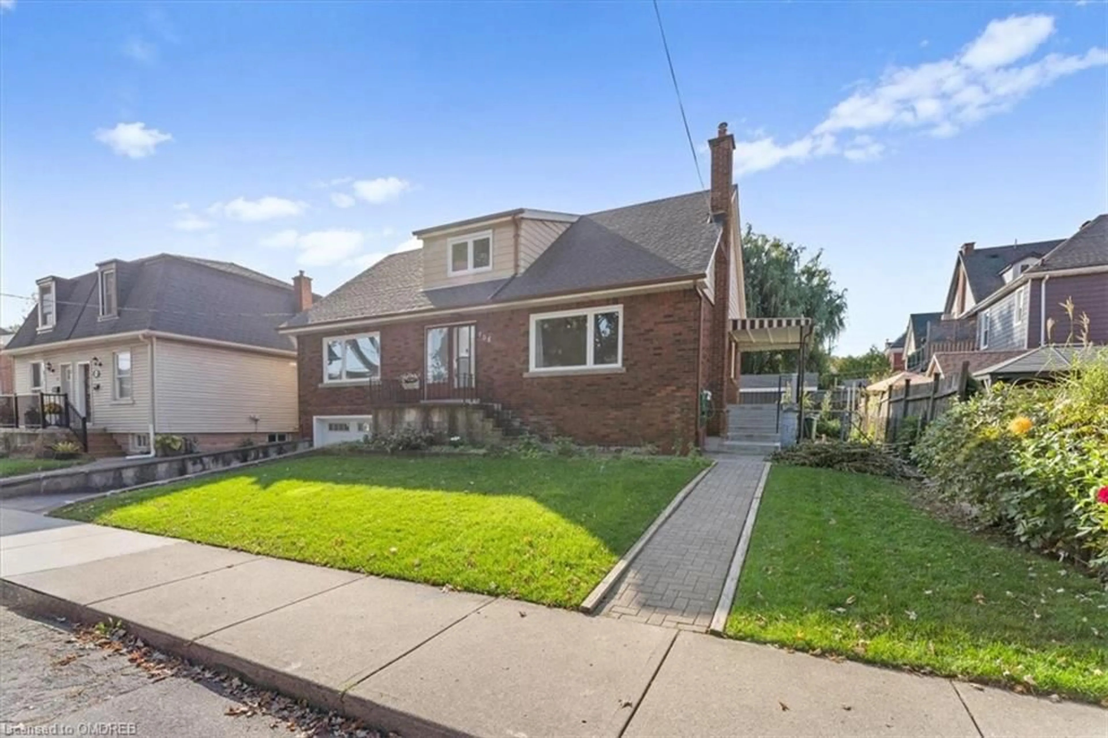 Frontside or backside of a home, the fenced backyard for 106 Simcoe St, Hamilton Ontario L8L 3N5