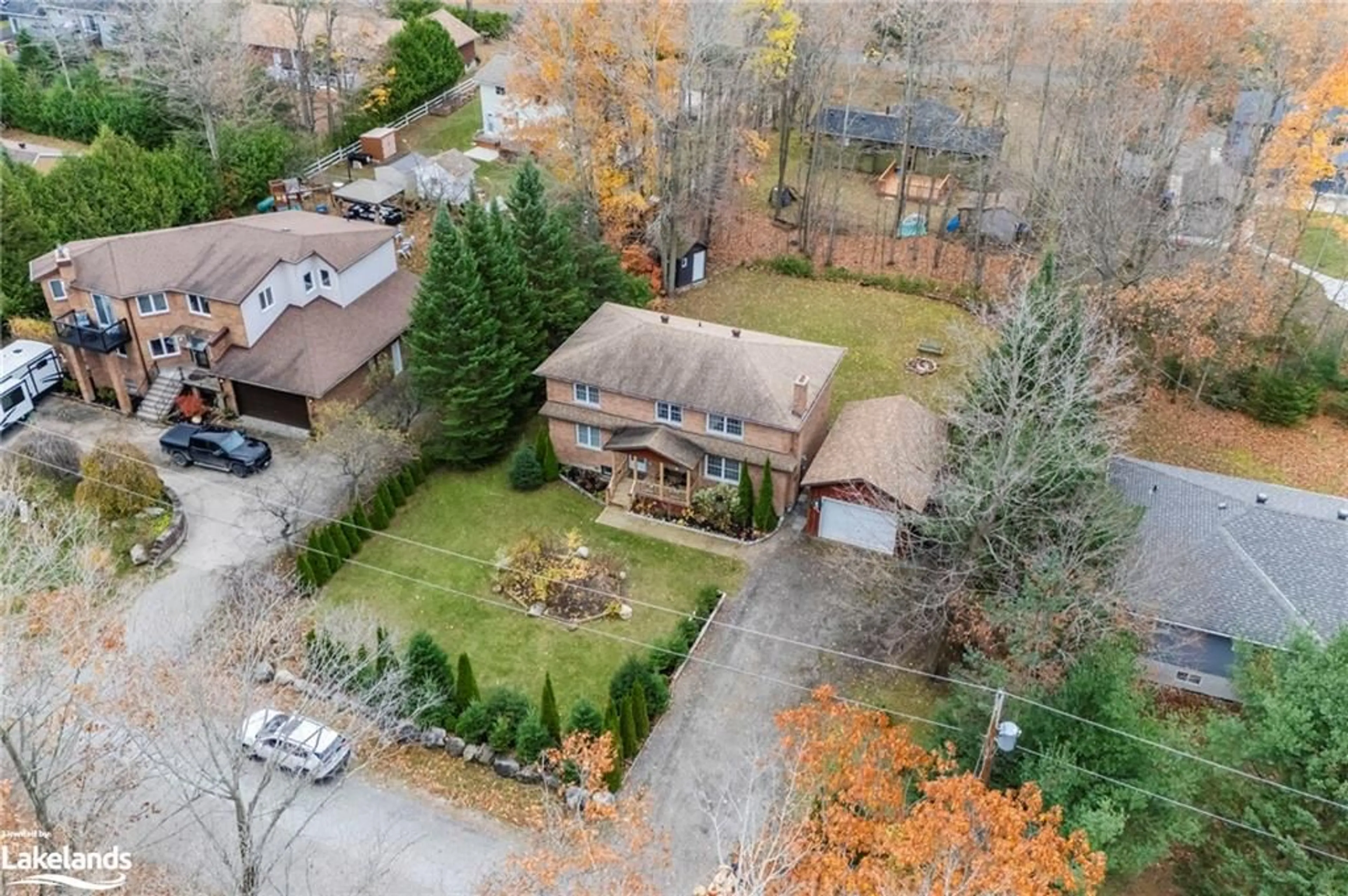 Frontside or backside of a home, the fenced backyard for 140 Wolfe Trail, Tiny Ontario L9M 0H7