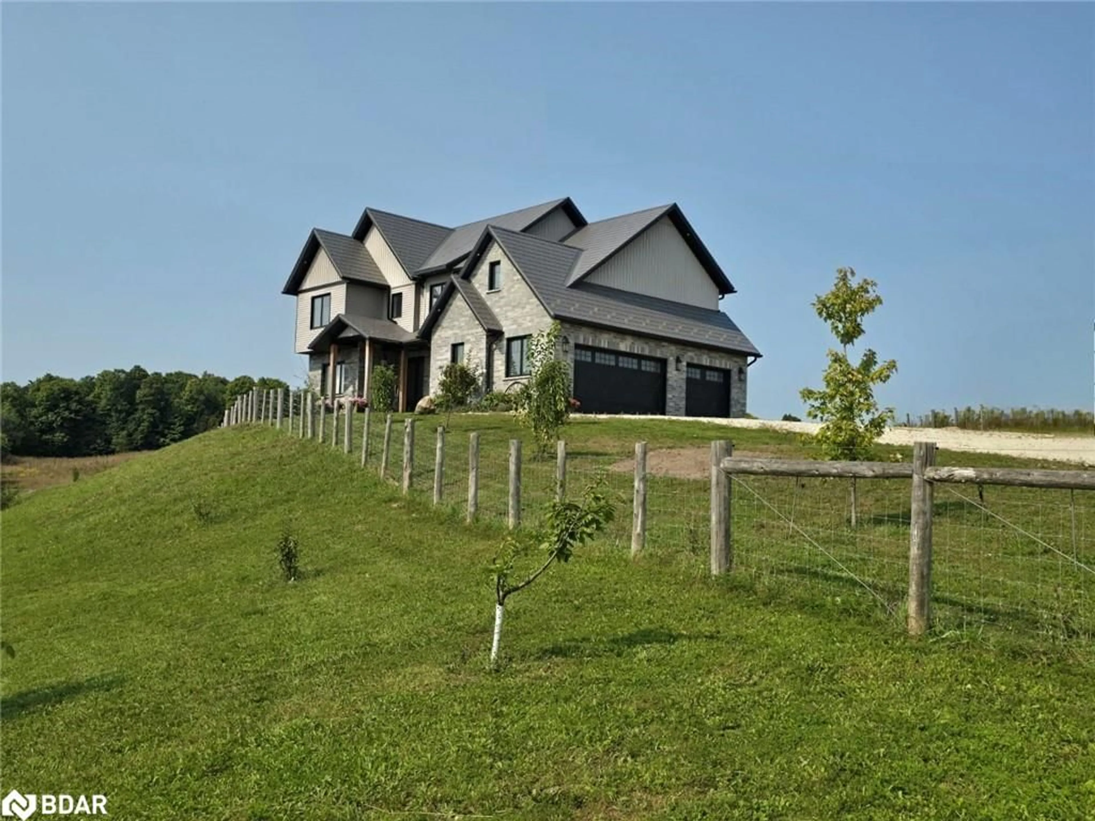 Frontside or backside of a home, the fenced backyard for 938666 Airport Road, Mulmur Ontario L9V 0M1