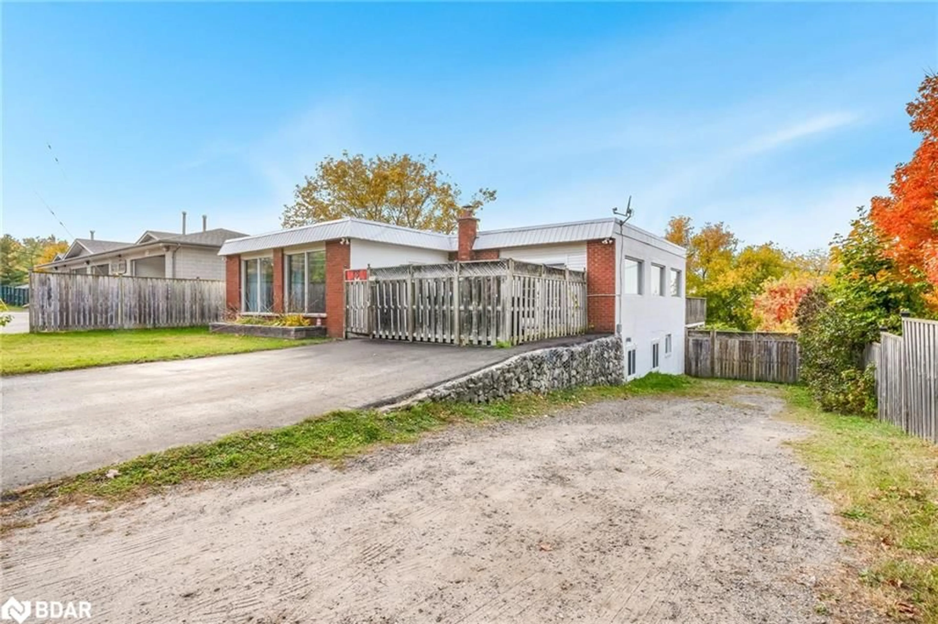 Frontside or backside of a home, the fenced backyard for 138 Richard St, Victoria Harbour Ontario L0K 2A0