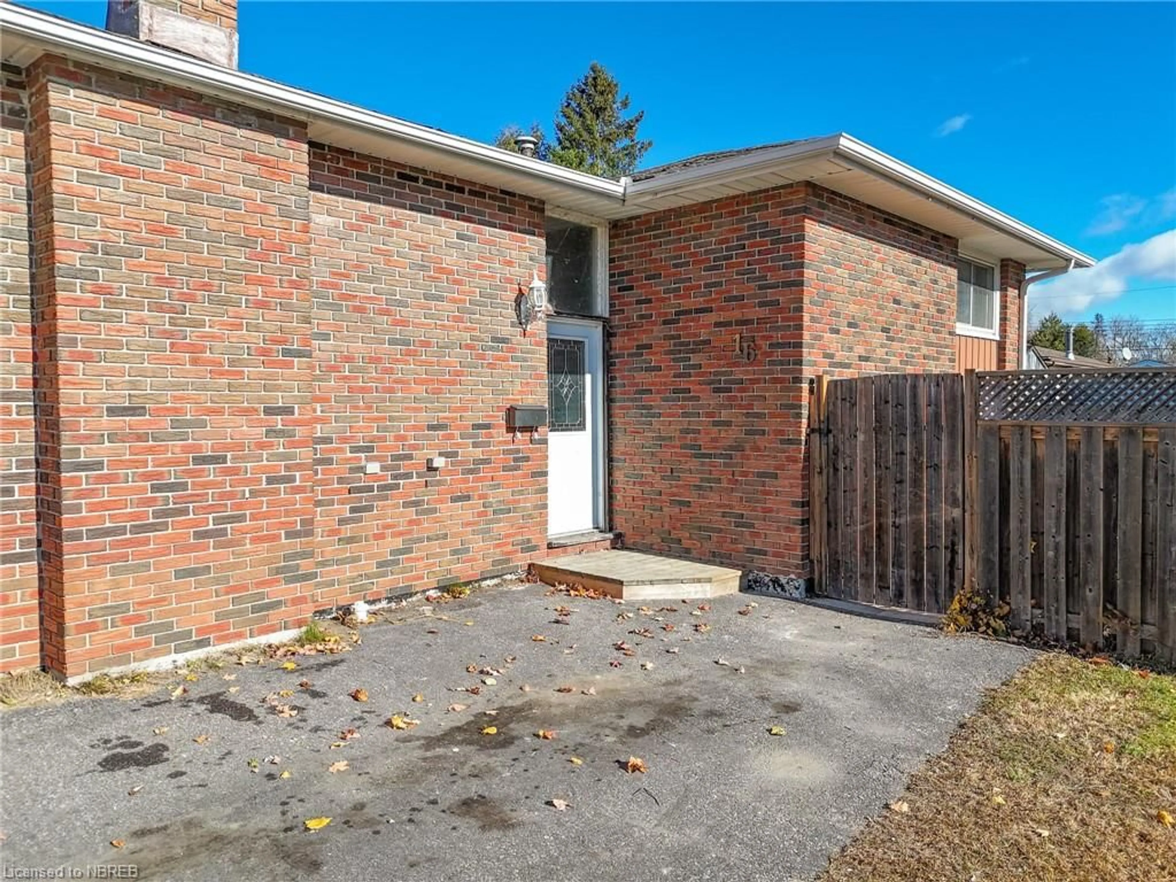 Frontside or backside of a home, the fenced backyard for 16 Cecelia Crt, North Bay Ontario P1A 2S3