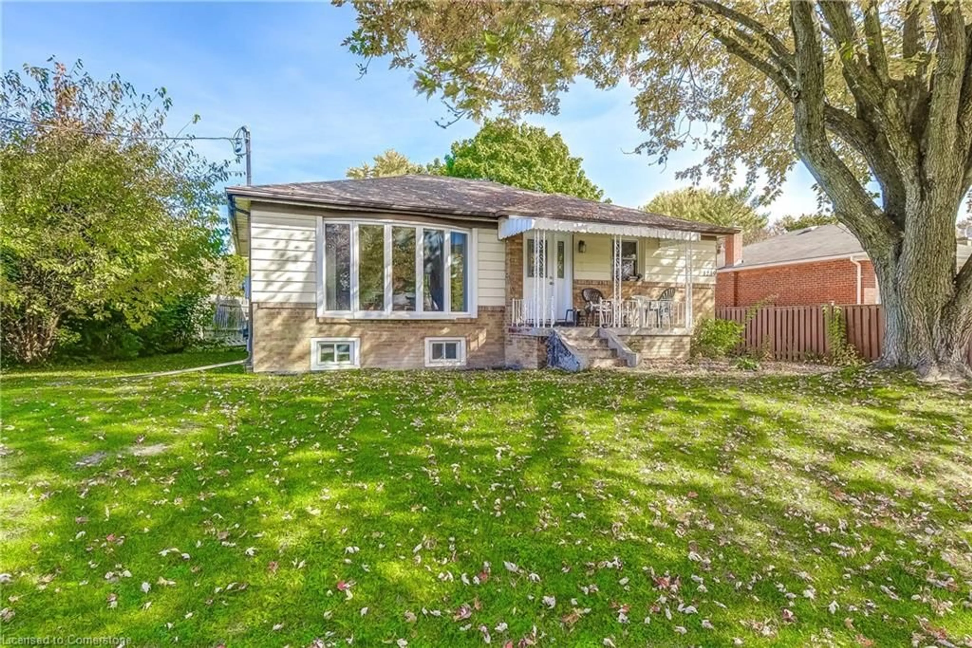 A pic from exterior of the house or condo, the fenced backyard for 1239 De Quincy Cres, Burlington Ontario L7P 1E2