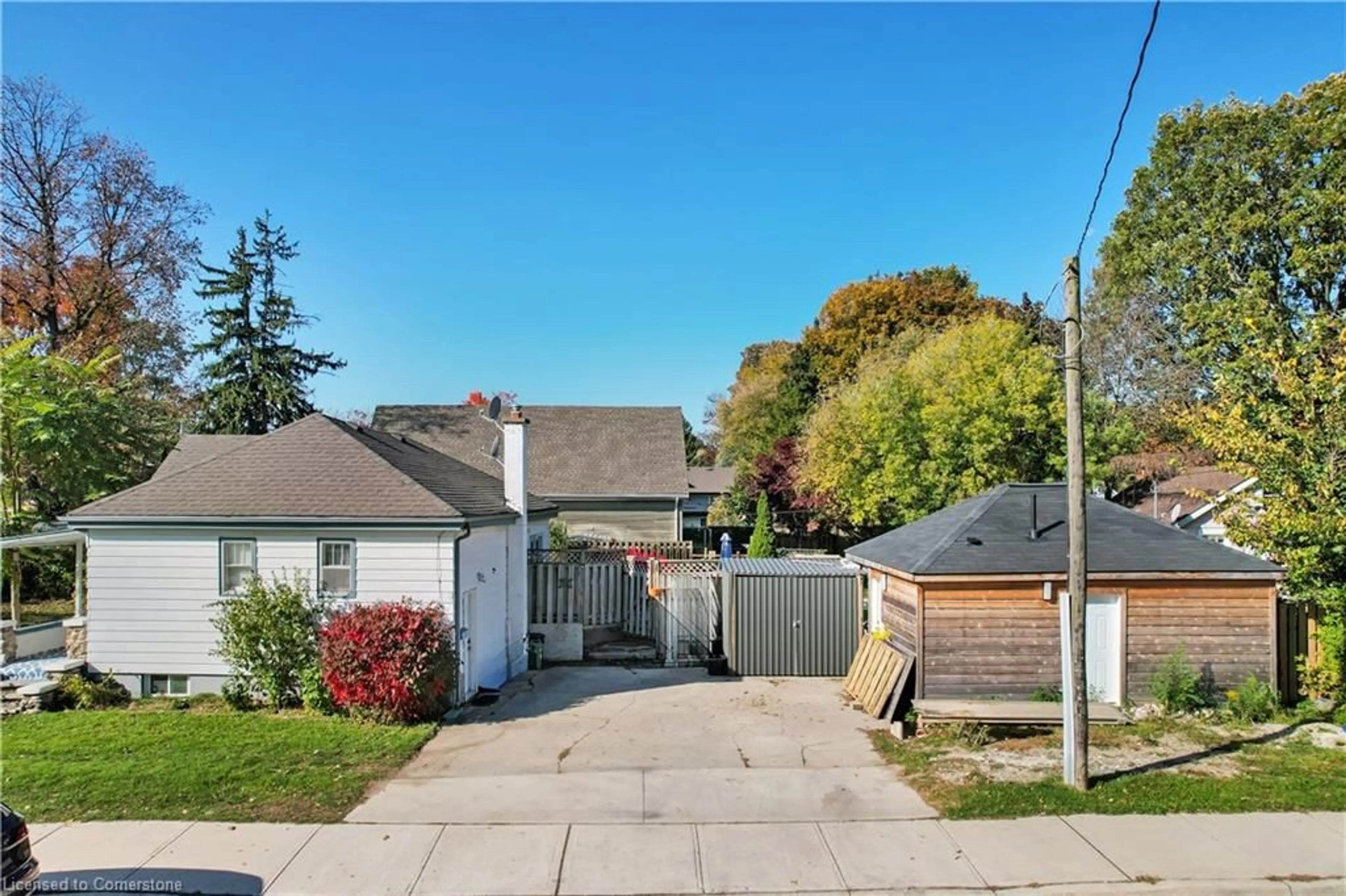 Frontside or backside of a home, the fenced backyard for 66 Langarth St, London Ontario N6J 1P4