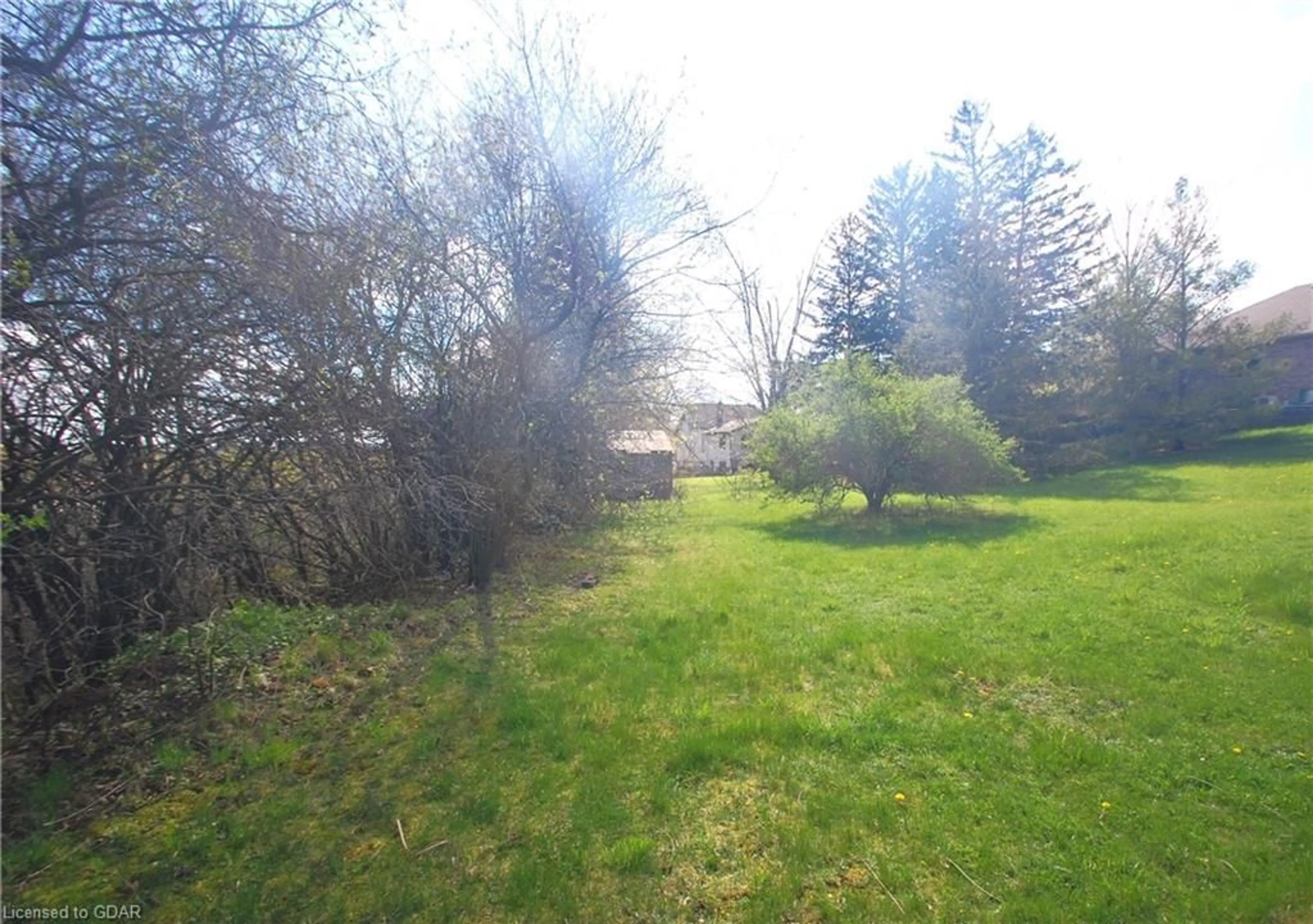 Frontside or backside of a home, the fenced backyard for 1 Hardy St, Guelph Ontario N1E 5G4