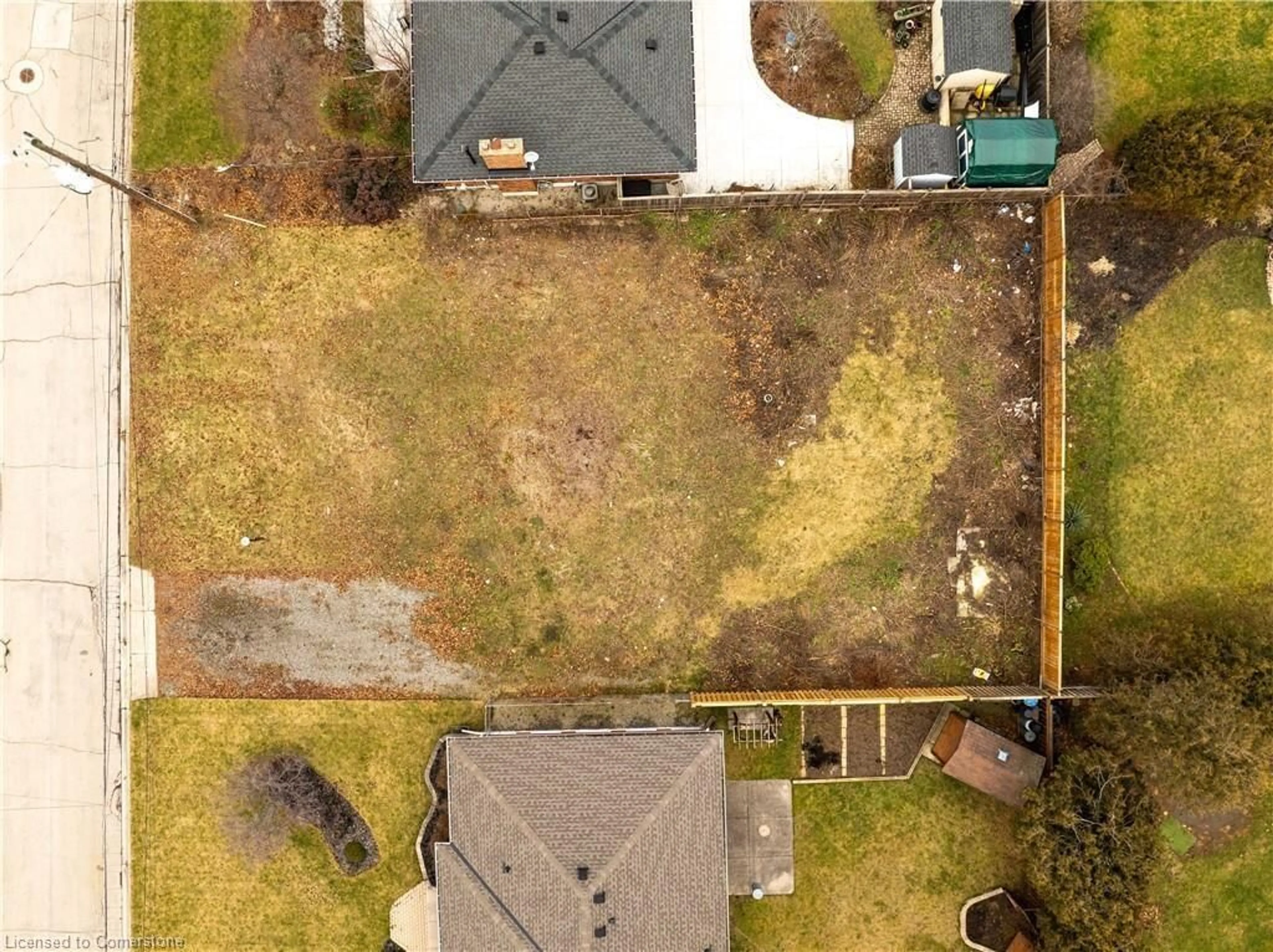 Frontside or backside of a home, the fenced backyard for 22 Alpine Ave, Hamilton Ontario L8G 2E2