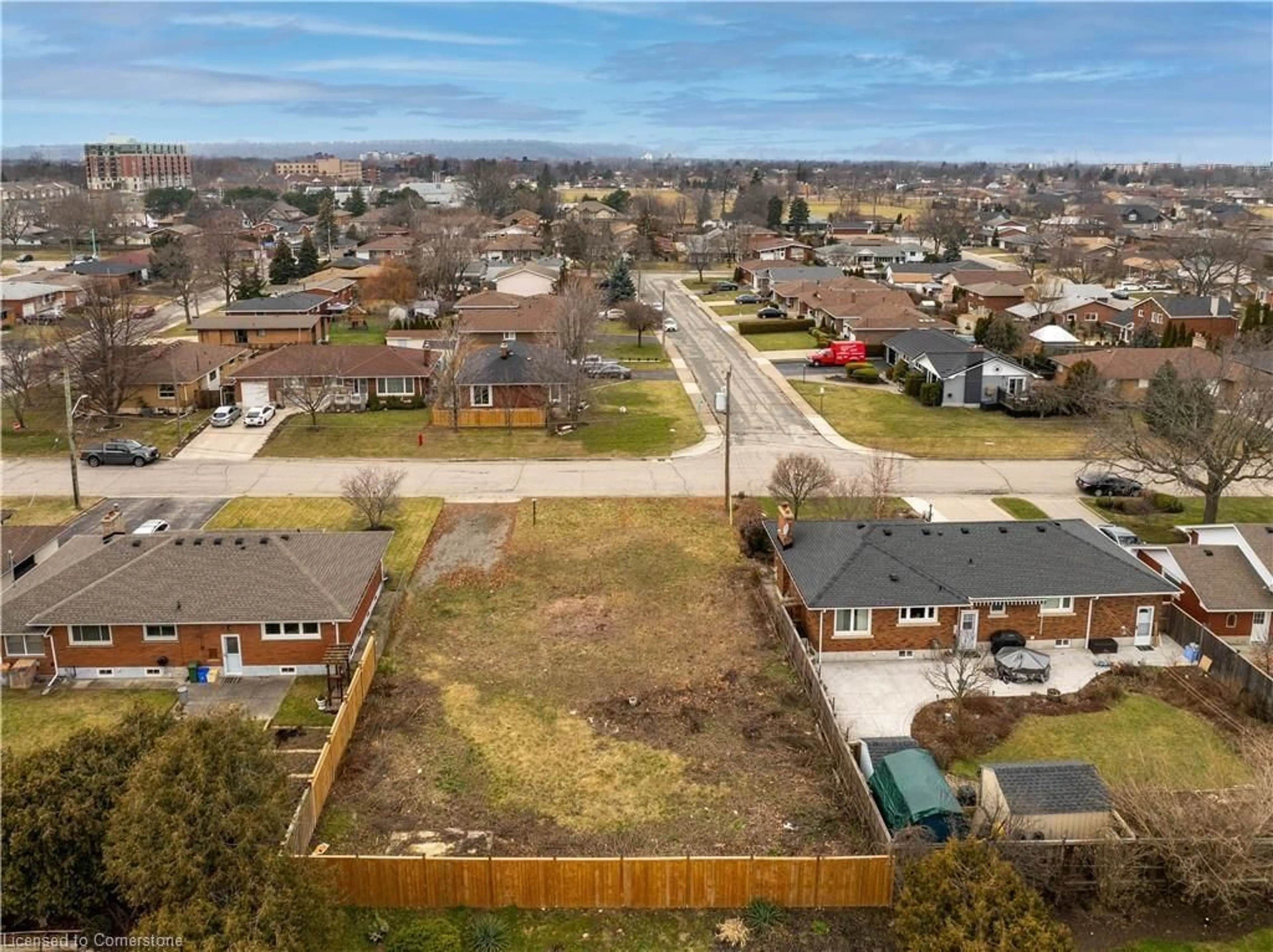 Frontside or backside of a home, the fenced backyard for 22 Alpine Ave, Hamilton Ontario L8G 2E2