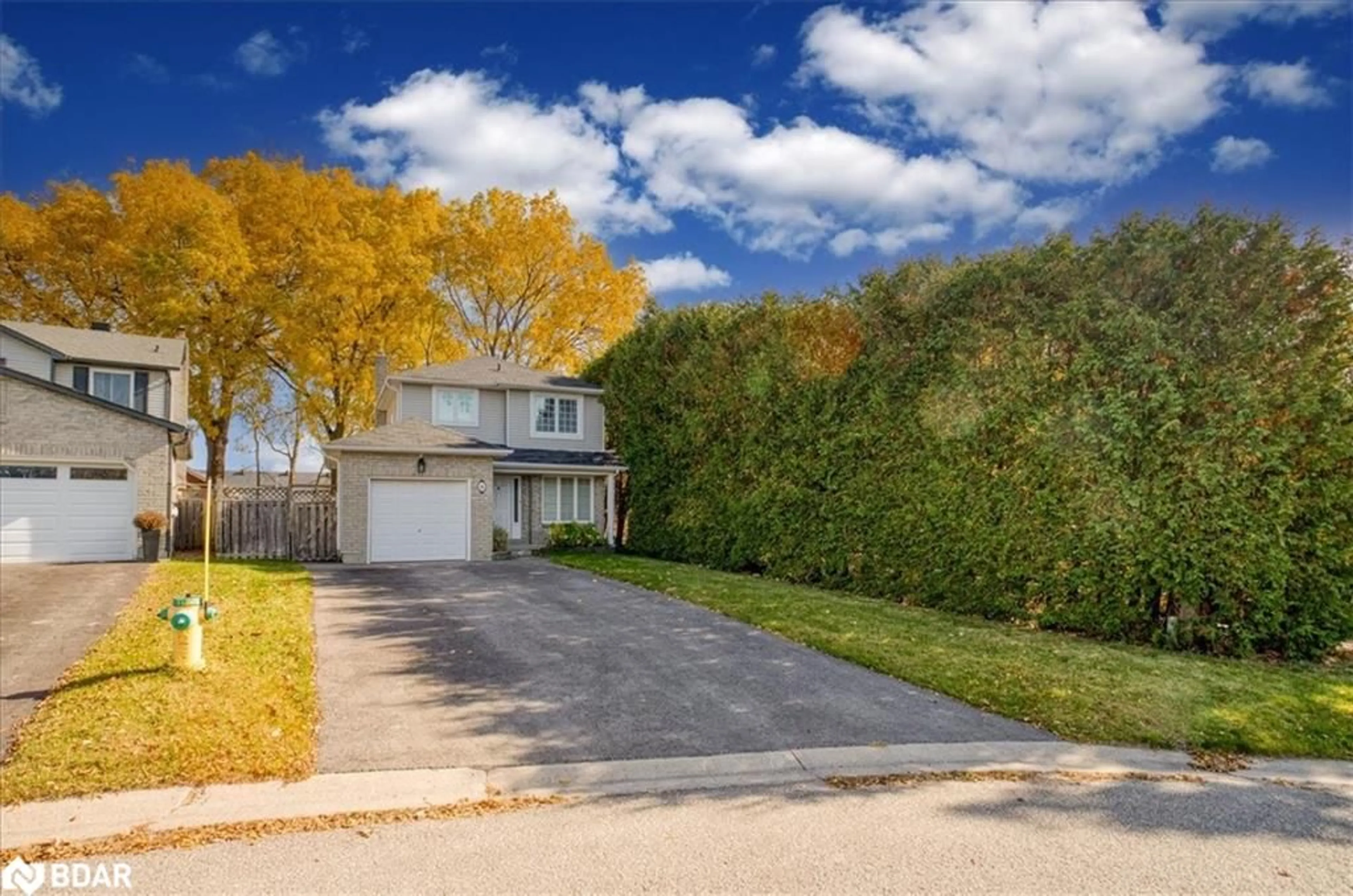 Frontside or backside of a home, the fenced backyard for 56 Knicely Rd, Barrie Ontario L4N 6V3