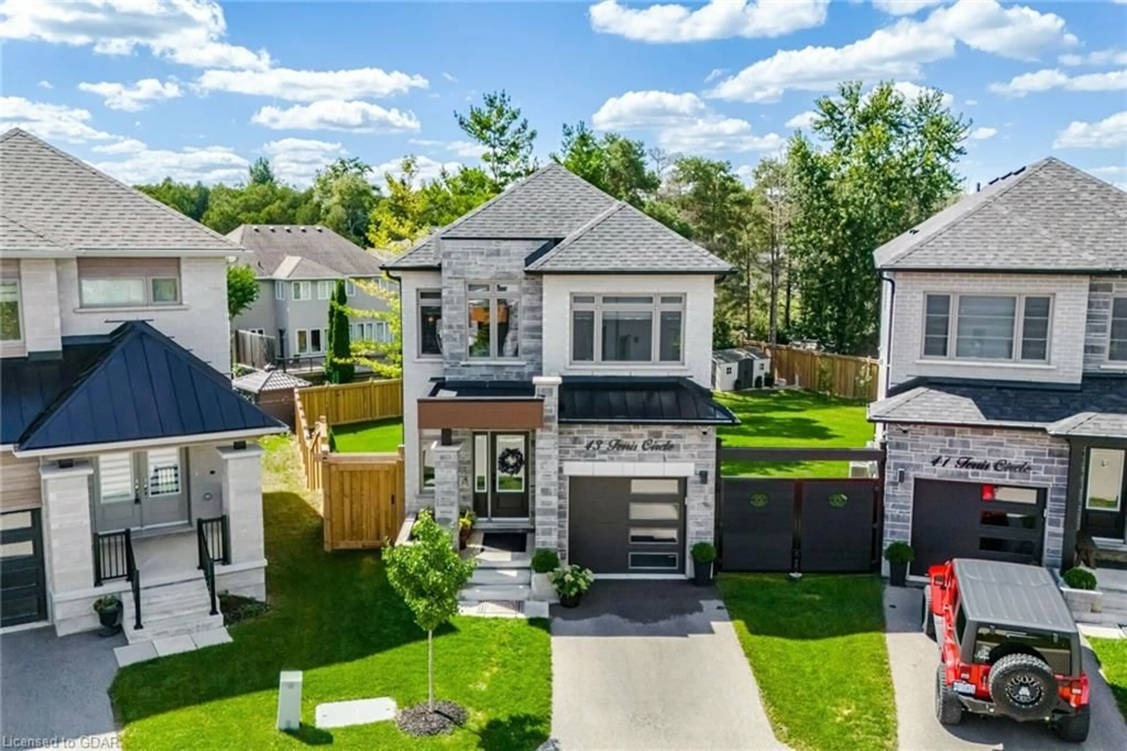 Frontside or backside of a home, the fenced backyard for 43 Ferris Cir, Guelph Ontario N1G 0H2