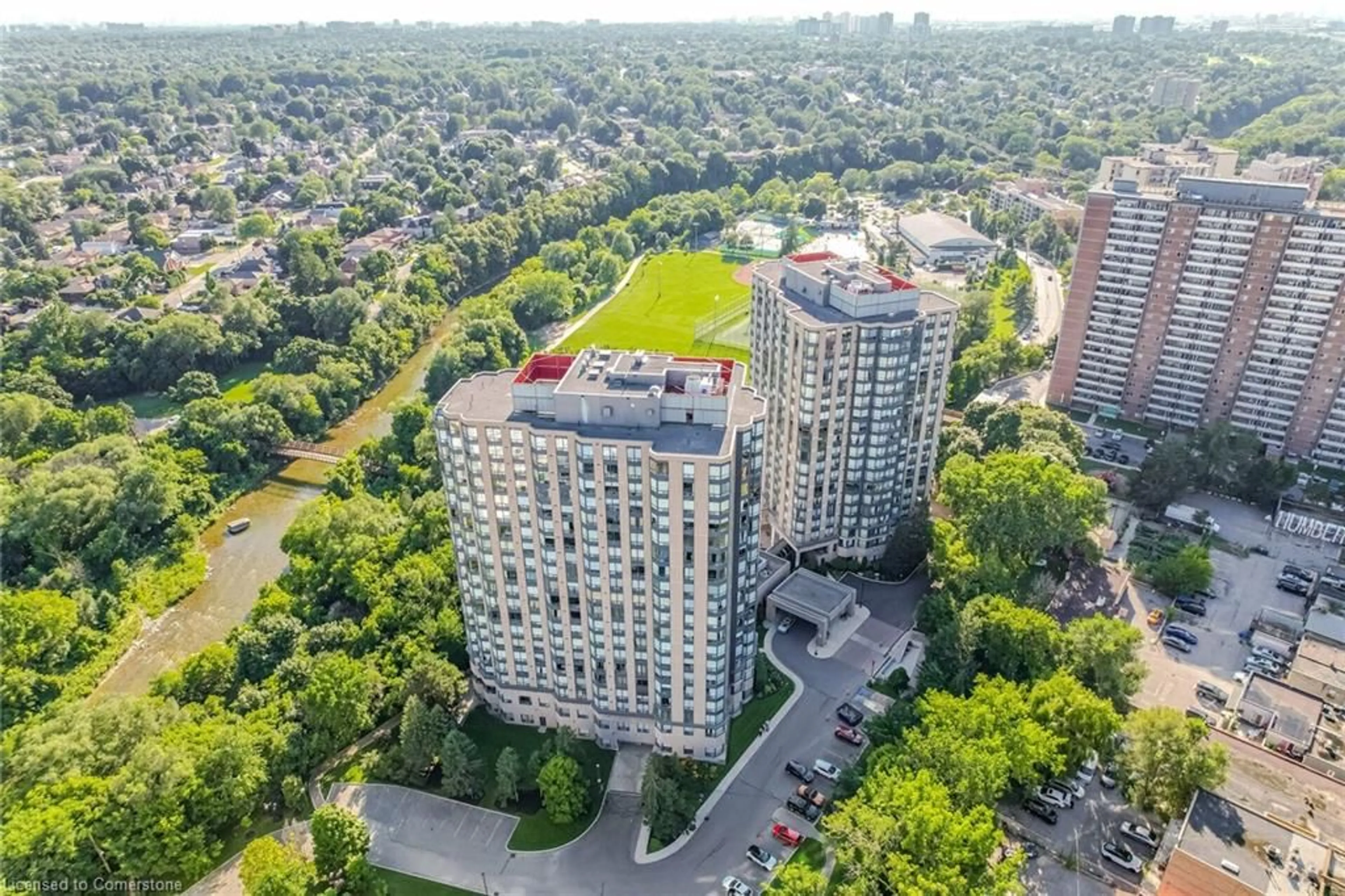 A pic from exterior of the house or condo, the view of city buildings for 1 Hickory Tree Rd #401, Toronto Ontario M9N 3W4