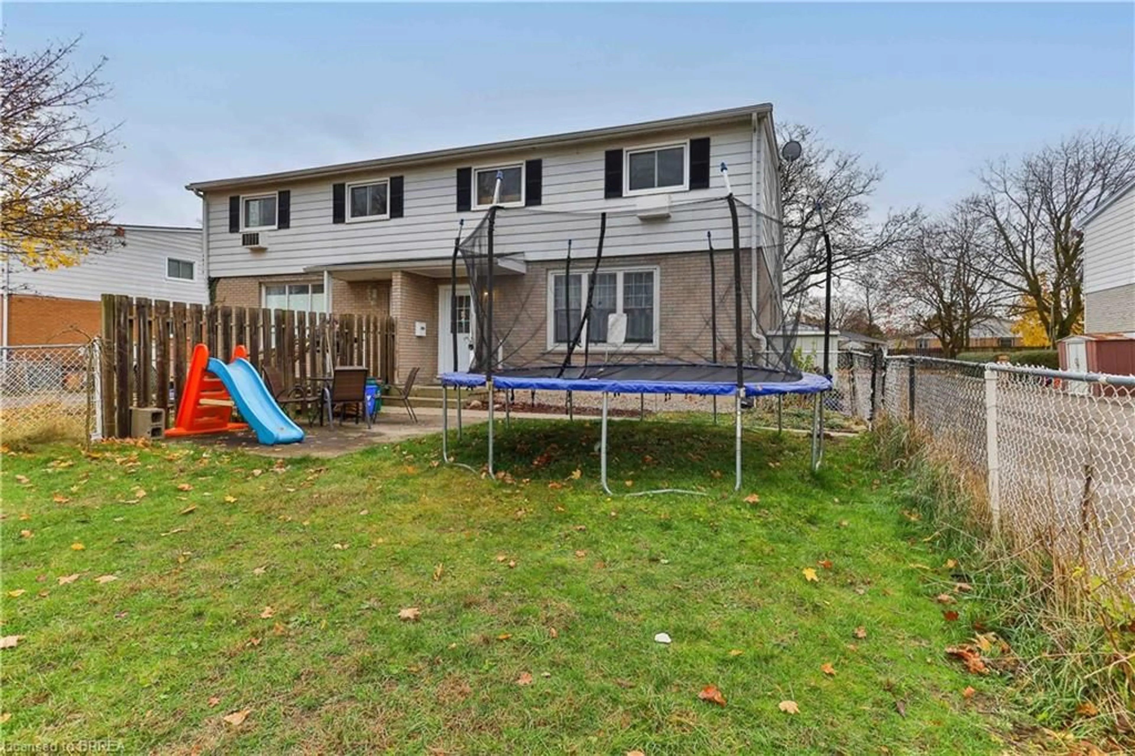 A pic from exterior of the house or condo, the fenced backyard for 43 Metcalfe Cres #C, Brantford Ontario N3R 2L7