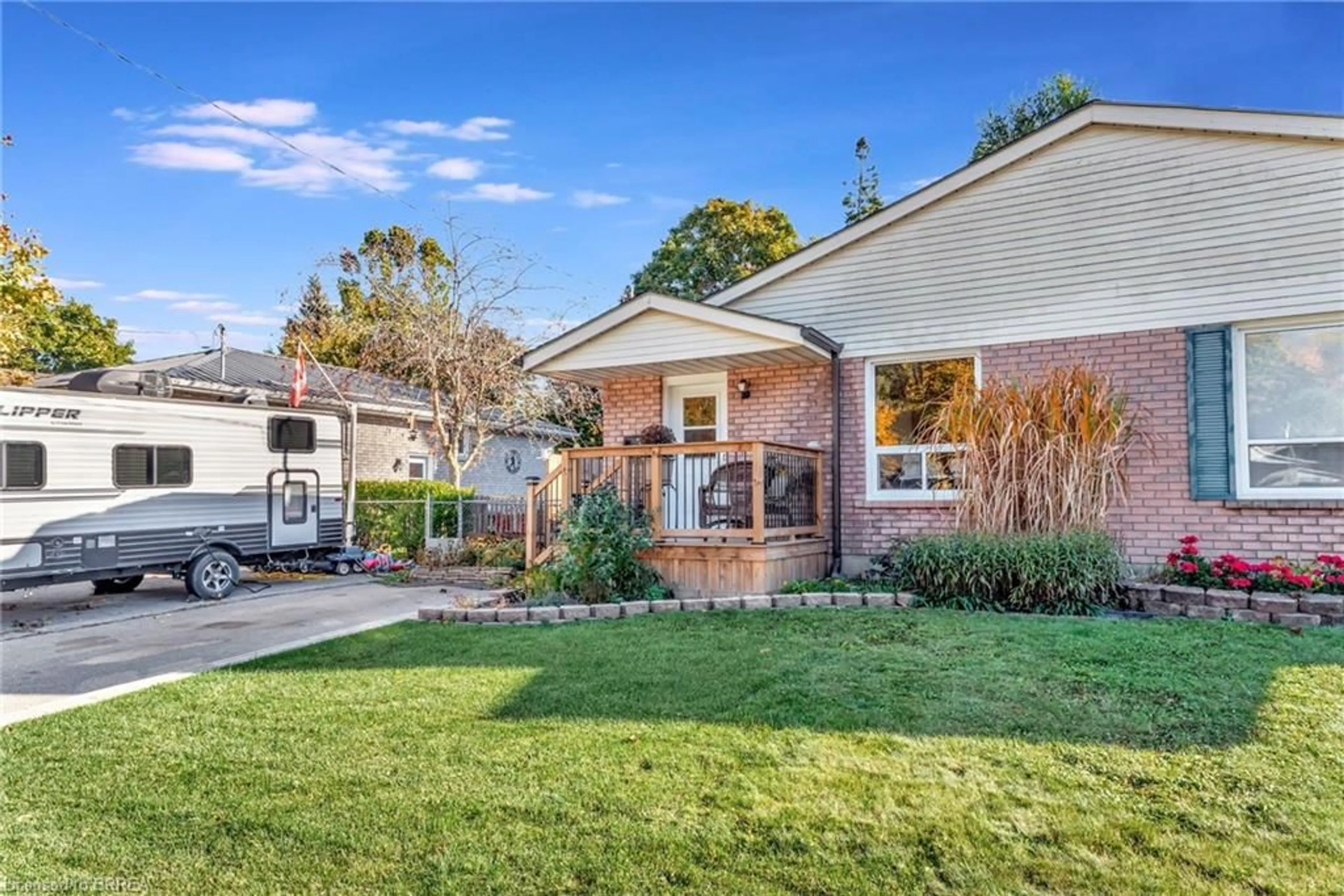 Frontside or backside of a home, the fenced backyard for 34 Amelia St, Paris Ontario N3L 3V5