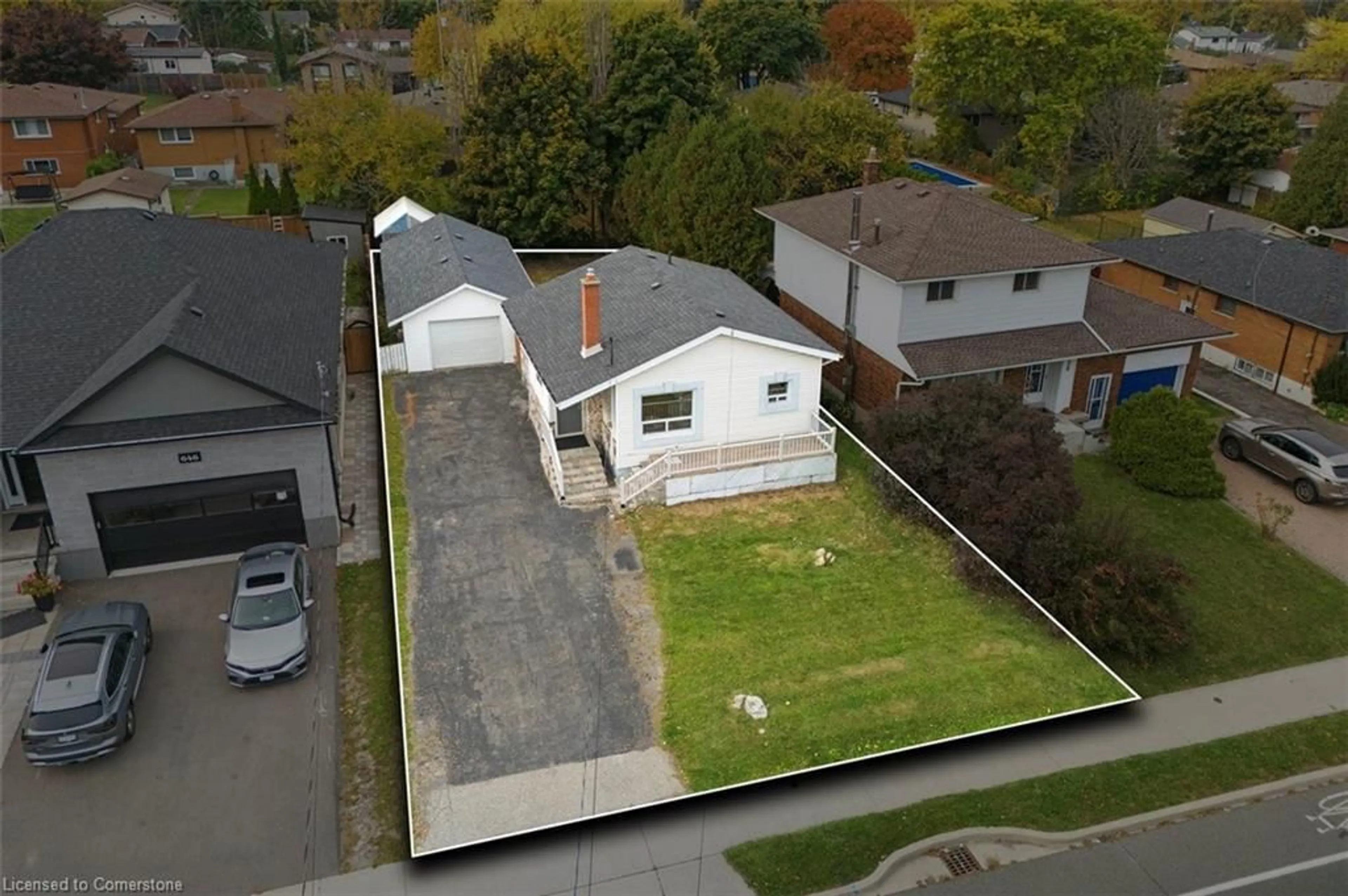 Frontside or backside of a home, the fenced backyard for 642 West 5th St, Hamilton Ontario L9C 3R2