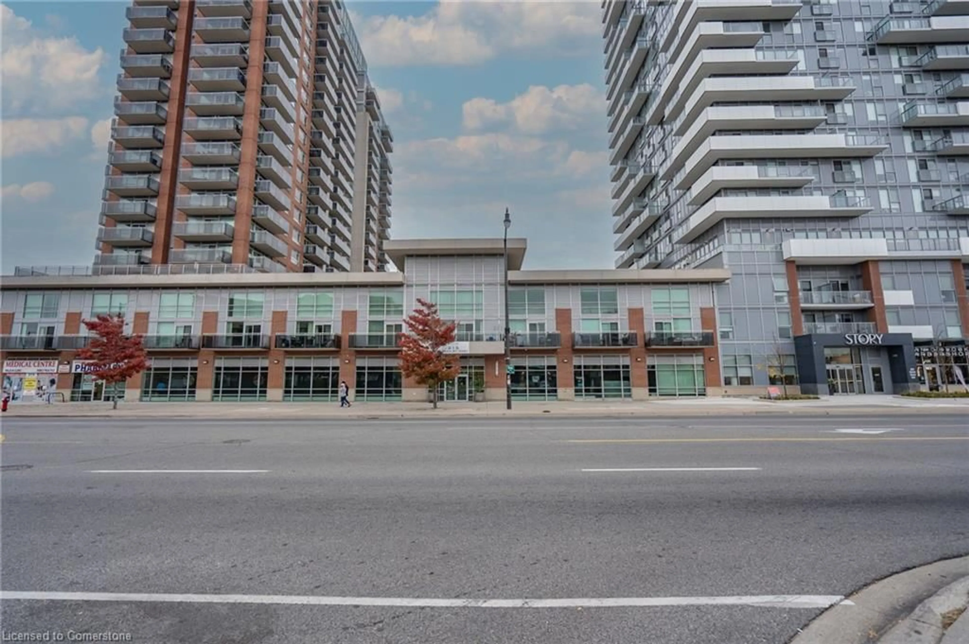 A pic from exterior of the house or condo, the street view for 215 Queen St #102, Brampton Ontario L6W 0A9