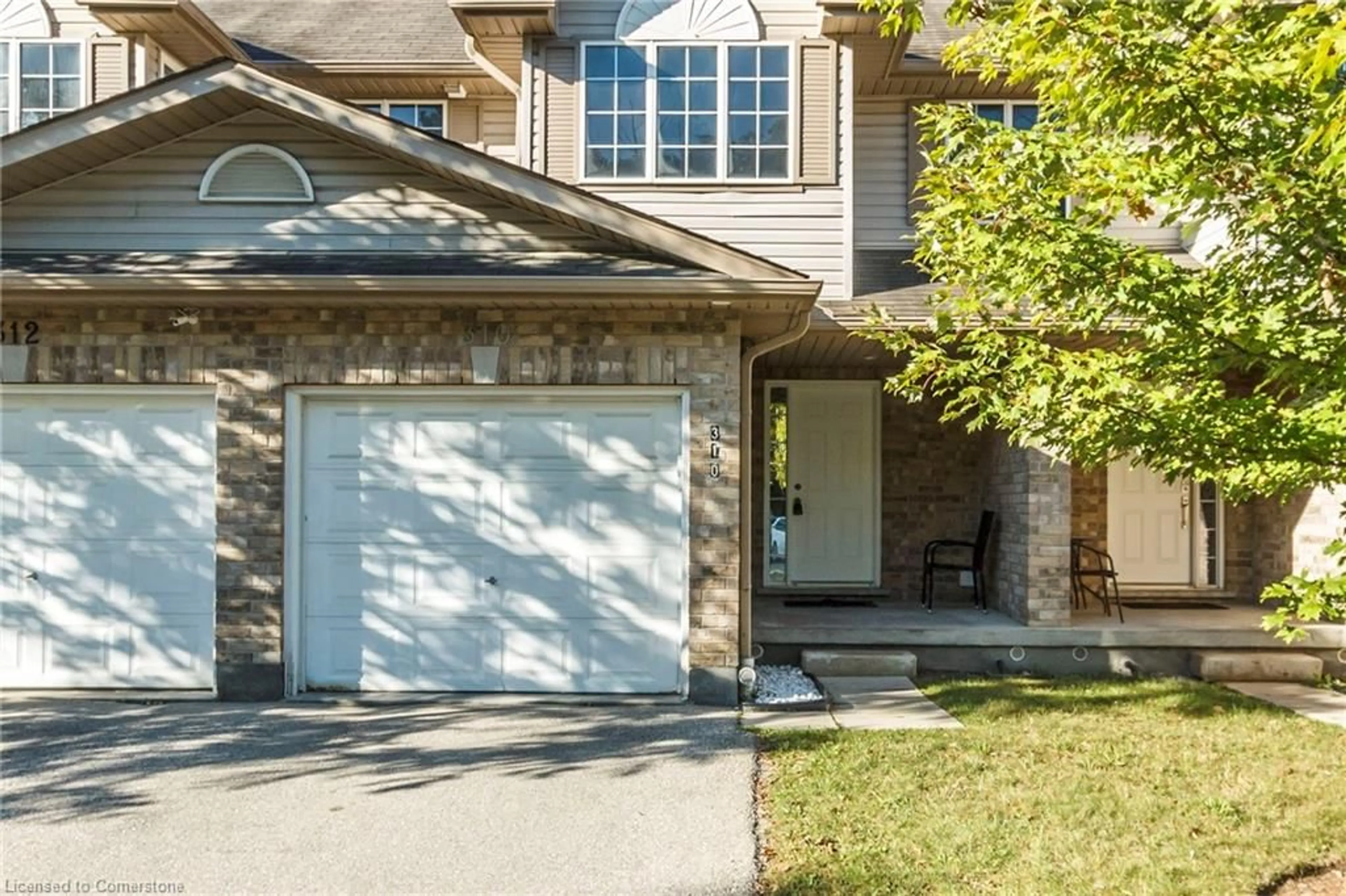 Frontside or backside of a home, cottage for 310 Fallowfield Dr, Kitchener Ontario N2C 0A9