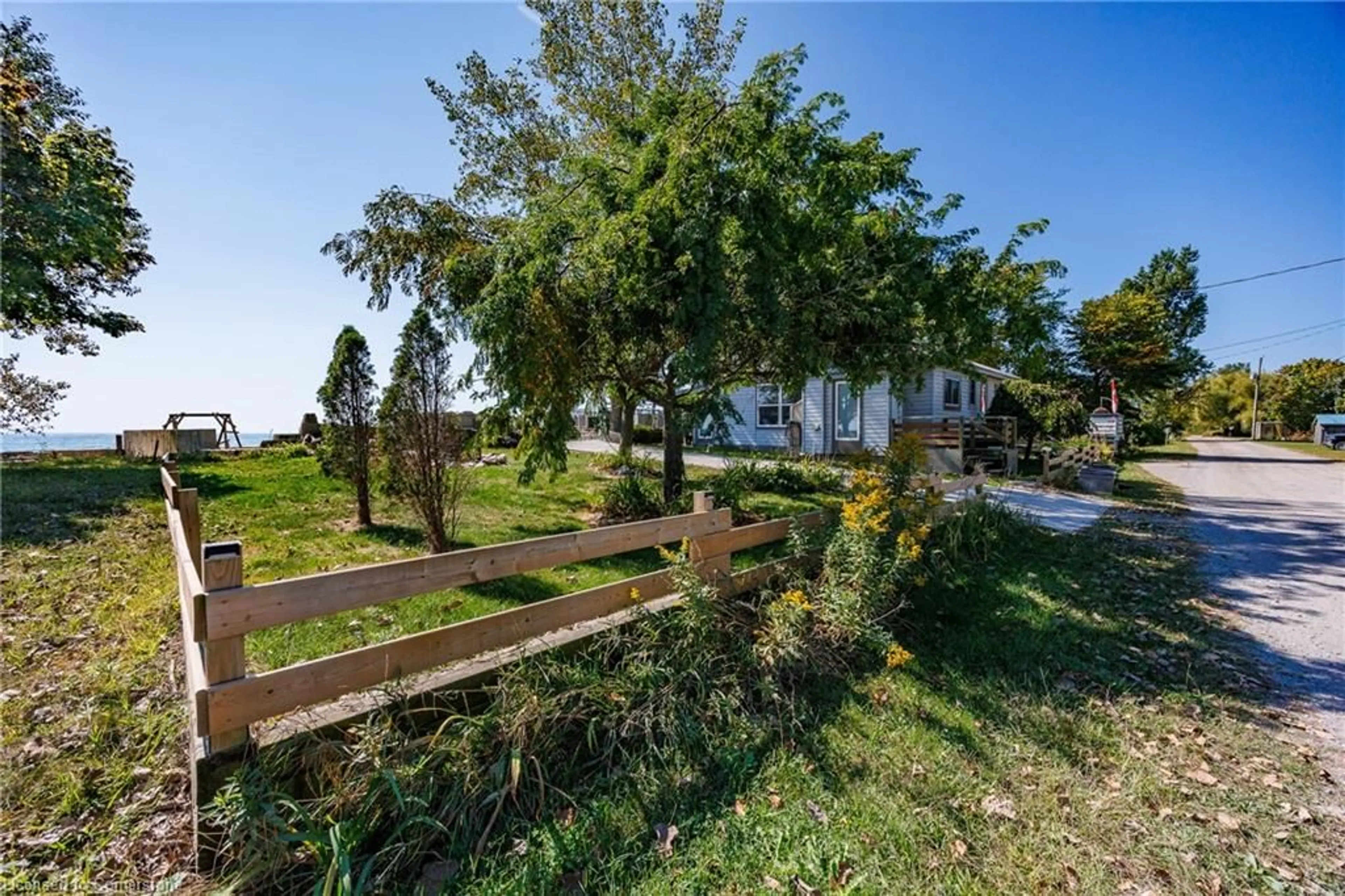 Patio, the fenced backyard for 205 - 203 Hastings Dr, Port Rowan Ontario N0E 1M0