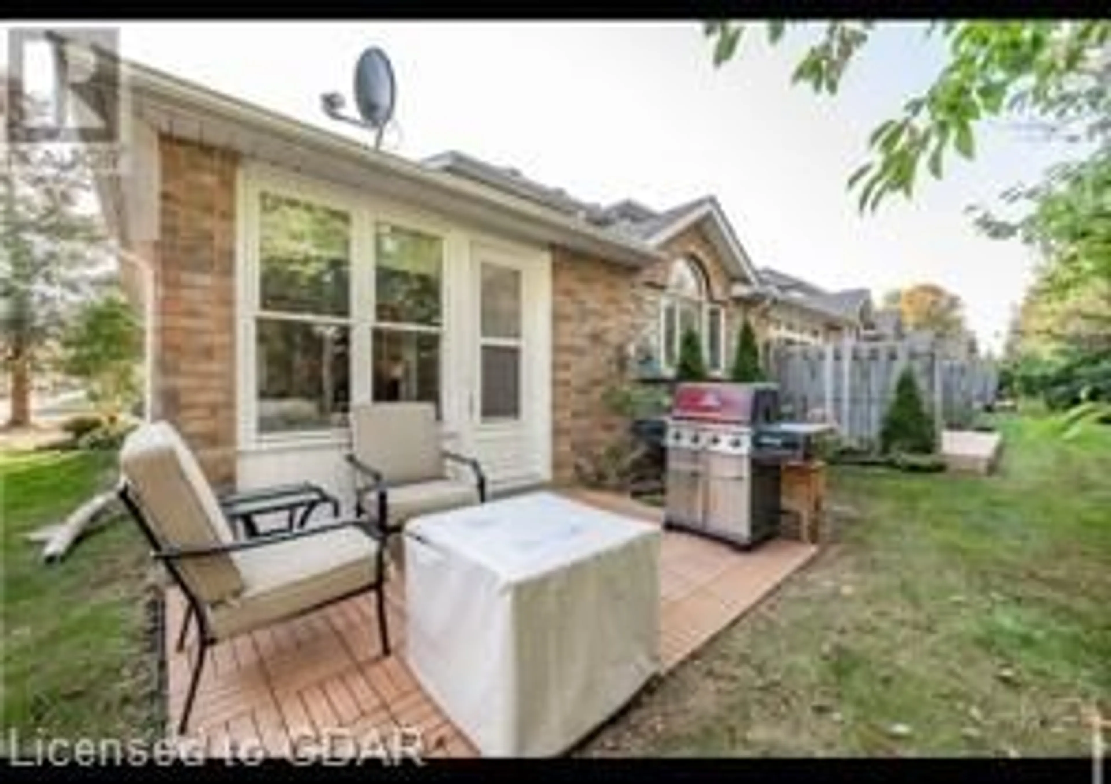 Patio, the fenced backyard for 1550 Gordon St #8, Guelph Ontario N1L 1C7